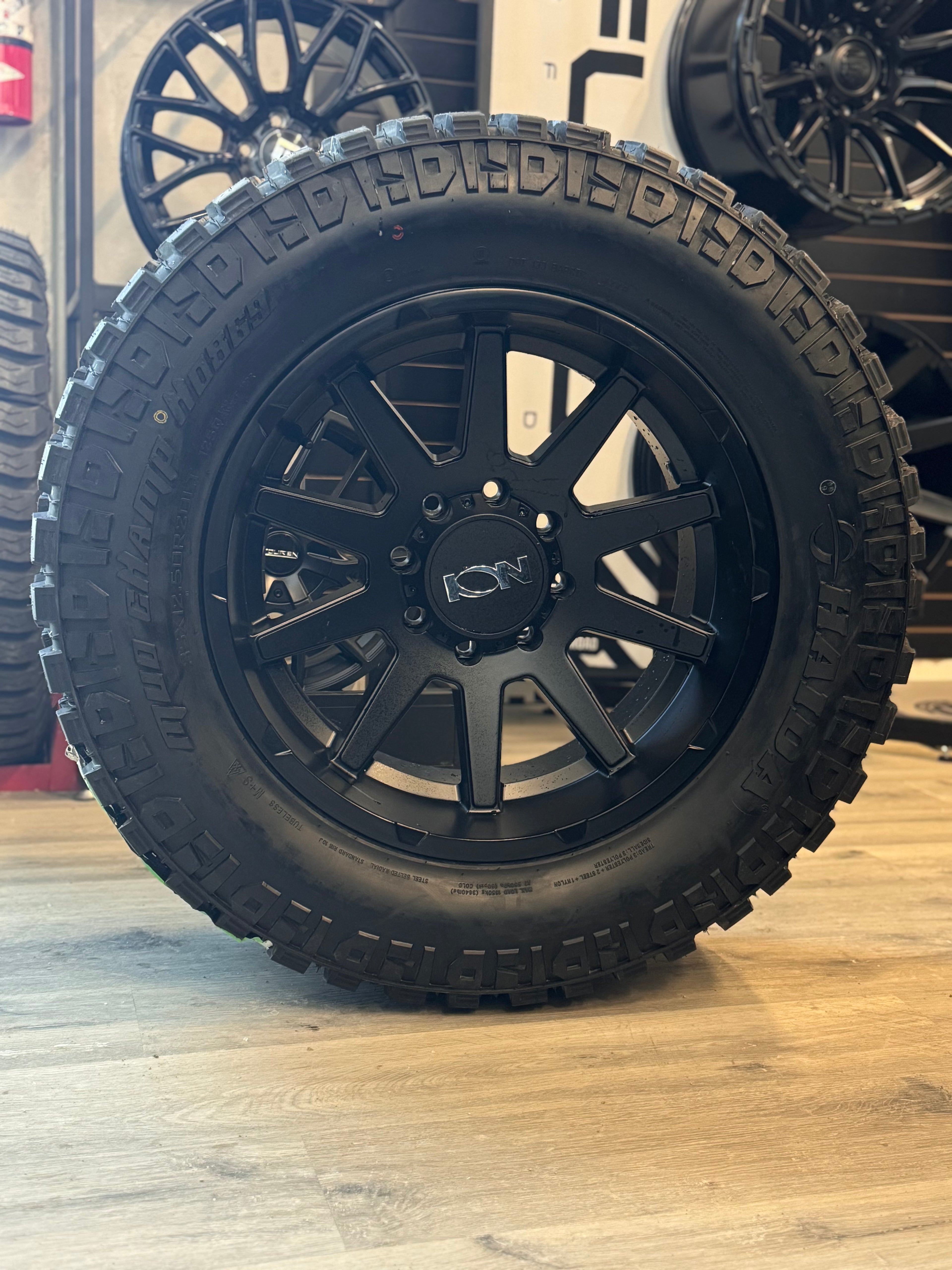 (SET OF FOUR) ION TYPE 143 MATTE BLACK 20X10 8X165.1 -19MM 125.2MM | HAIDA HD 869 MUD CHAMP M/T 35X12.50R20 LT (3PMS)