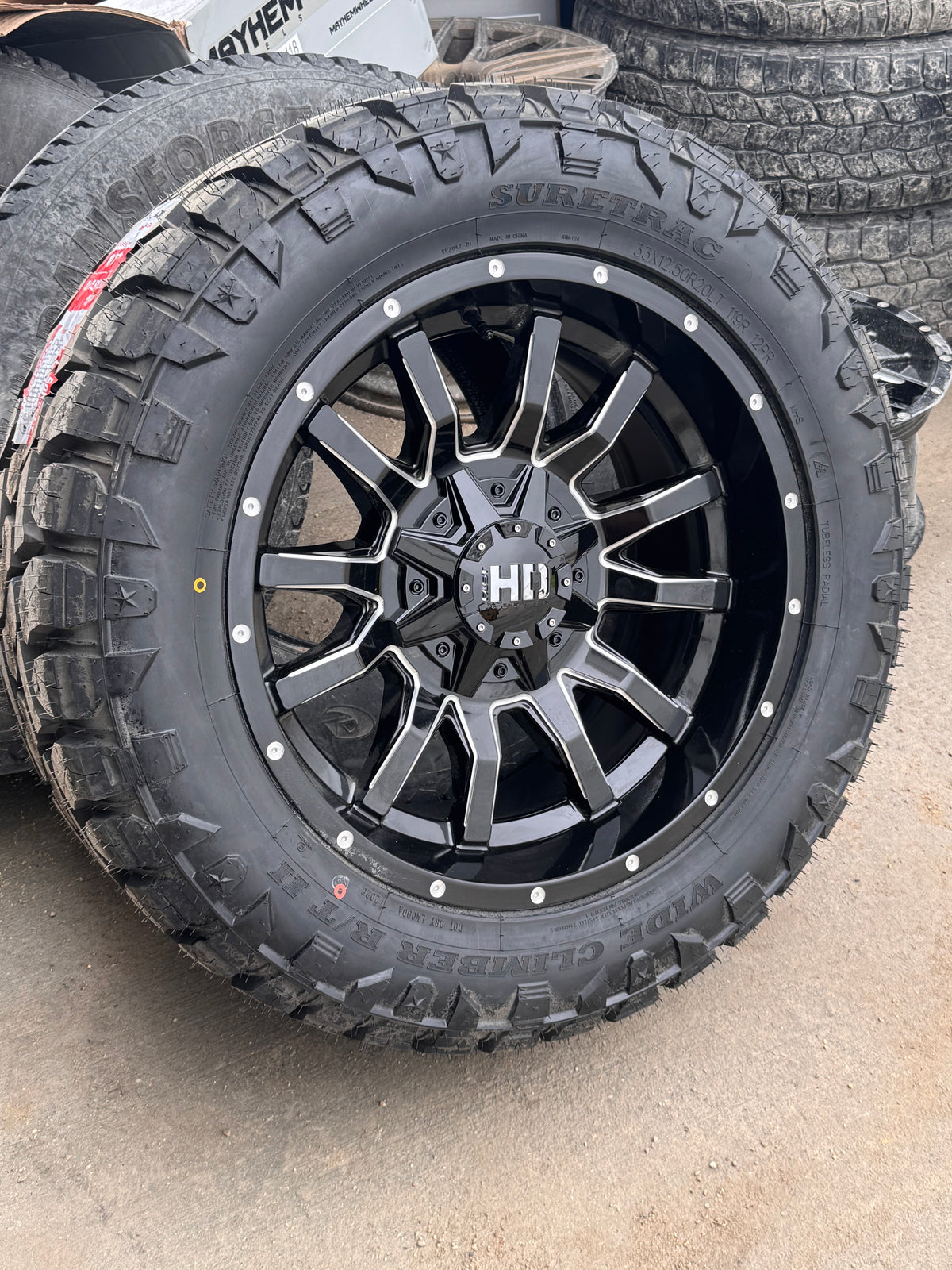 ( SET OF FOUR ) FAST HD TRAXX GLOSS BLACK MILLED 20X10 -18 6X135/6X139.7MM 95.1MM | SURETRAC R/T 2 WIDE CLIMBER LT 33X12.50R20 3PMS 12PLY