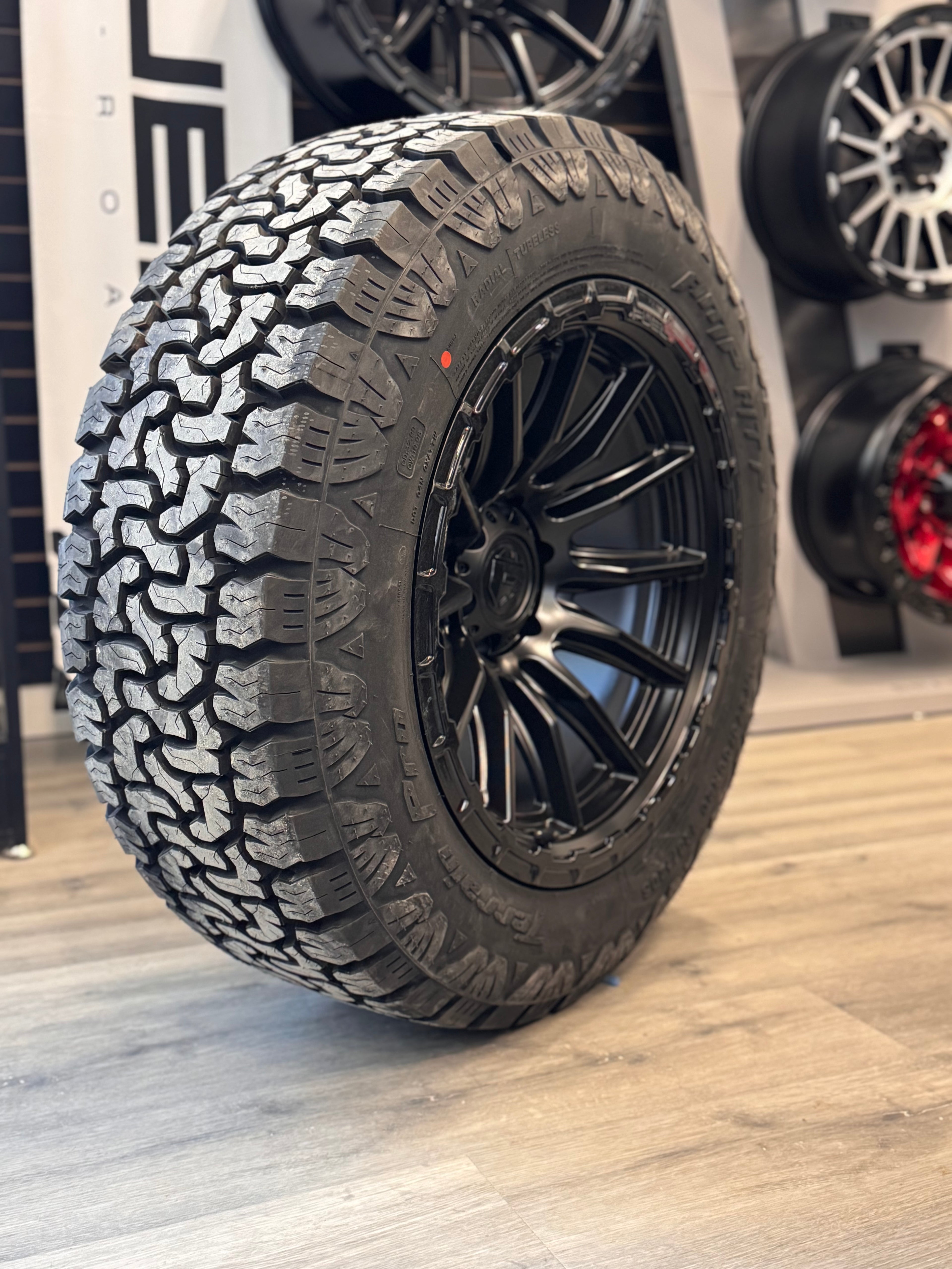 ( SET OF FOUR ) FUEL PISTON 20X10 -18 6X135 87 BLACKOUT W/ GLOSS BLACK LIP | AMP TERRAIN PRO 275/60R20