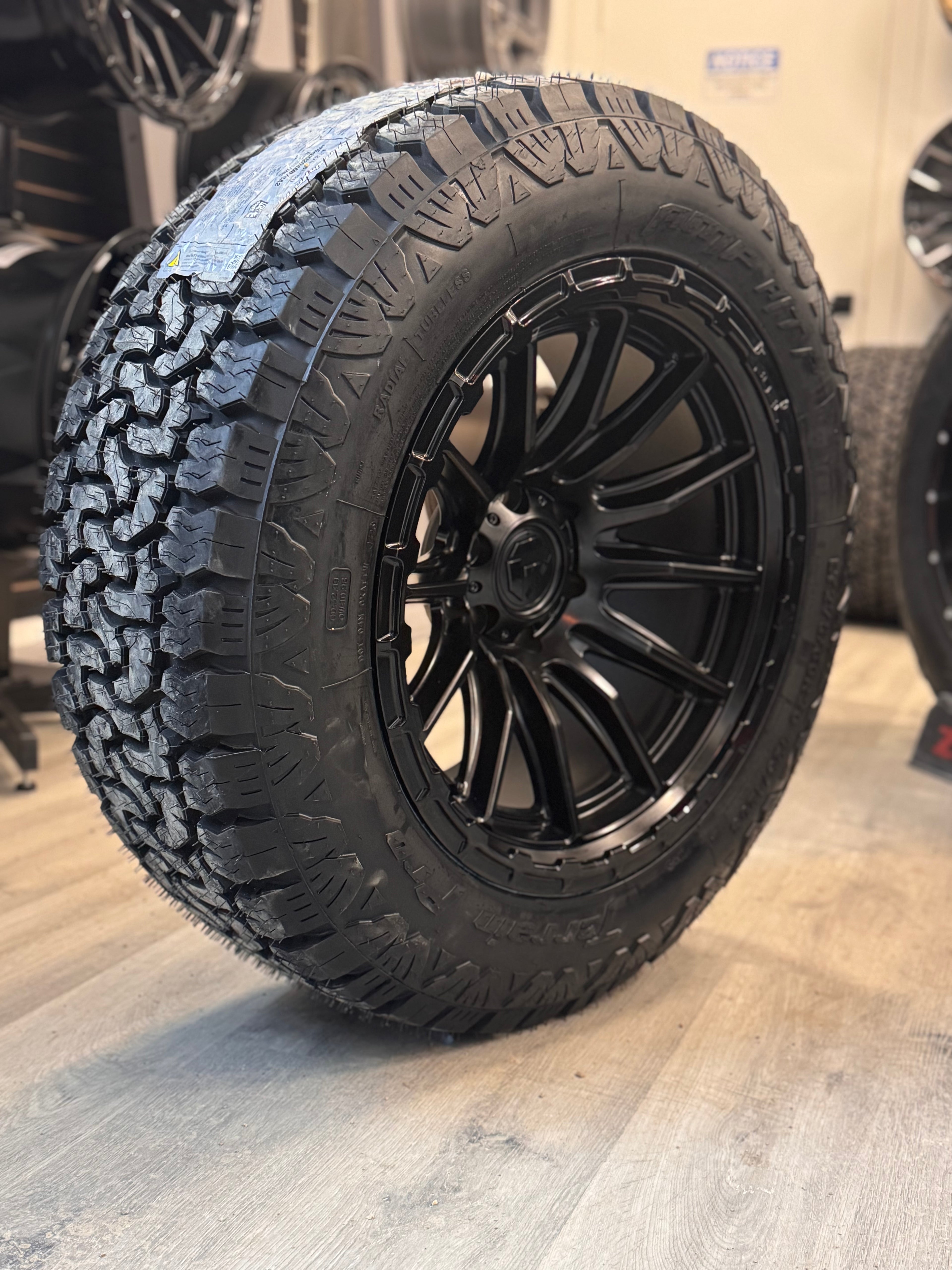 (SET OF FOUR) FUEL PISTON 20X10 -18 6X135 87 BLACKOUT W/ GLOSS BLACK LIP | 275/60R20 AMP TERRAIN PRO