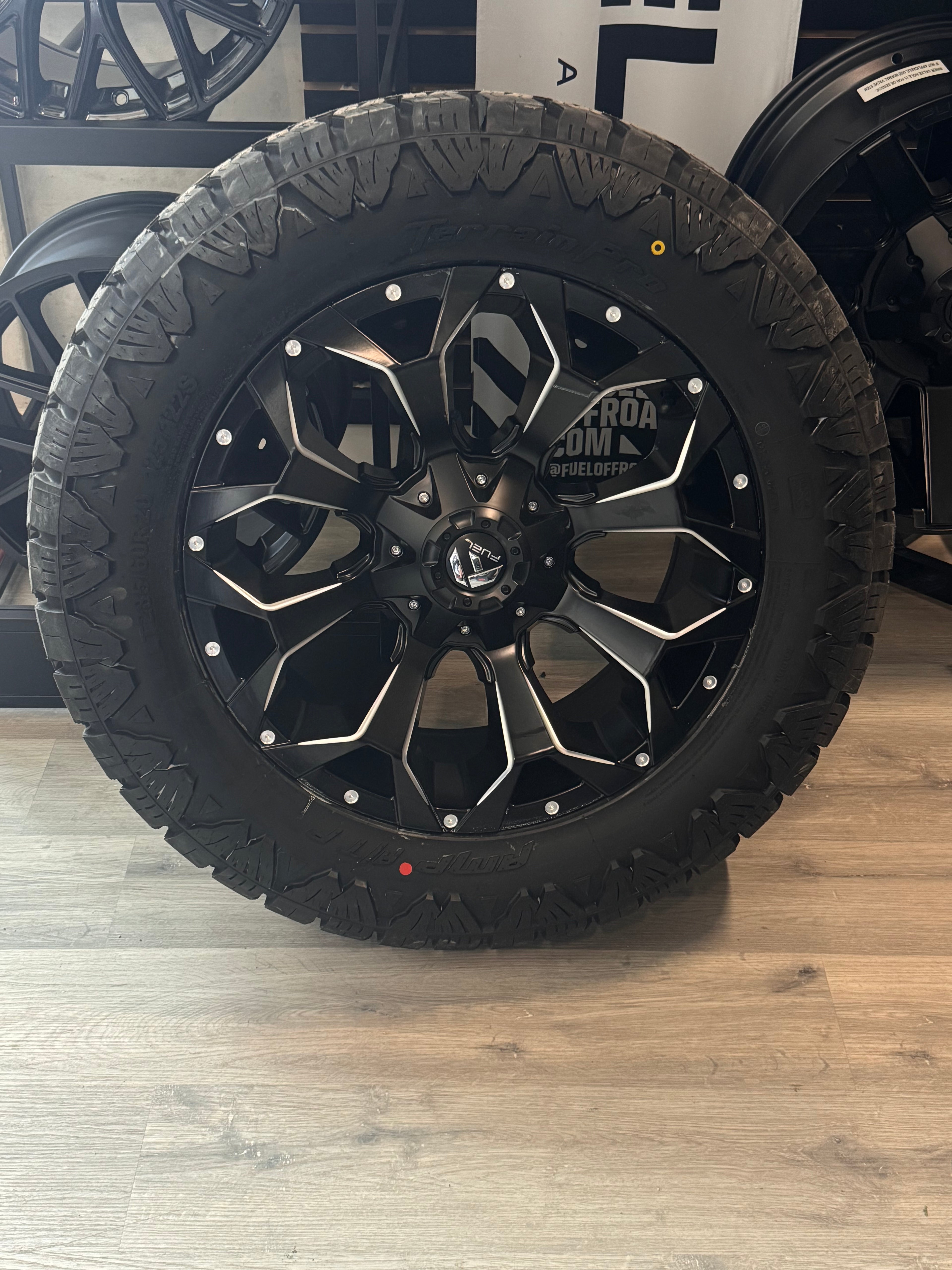 ( SET OF FOUR ) FUEL ASSAULT MATTE BLACK MILLED 20X9 +20 6X135/6X139.7 | 285/60R20 AMP TERRAIN PRO