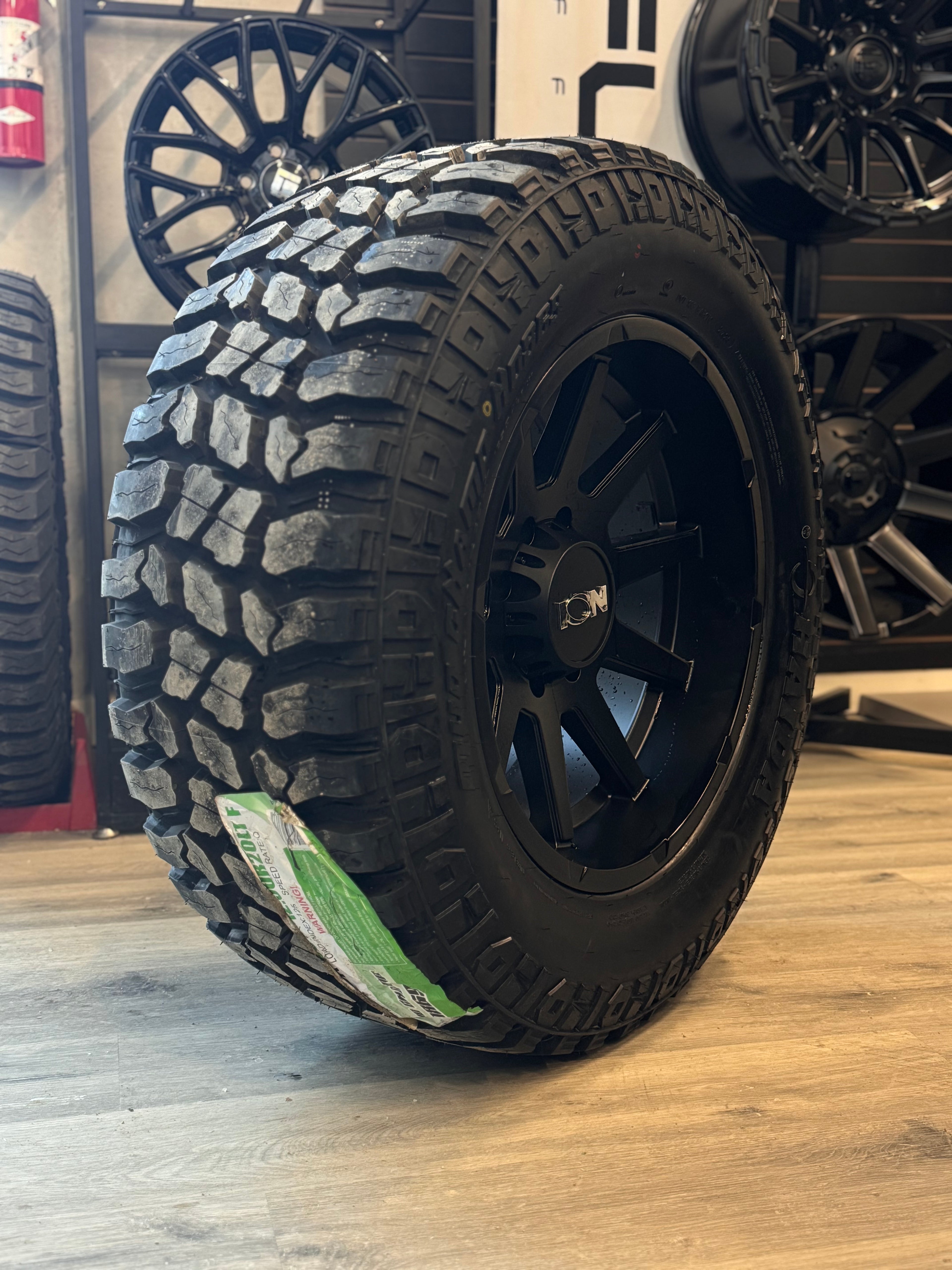 (SET OF FOUR) ION TYPE 143 MATTE BLACK 20X10 8X165.1 -19MM 125.2MM | HAIDA HD 869 MUD CHAMP M/T 35X12.50R20 LT (3PMS)