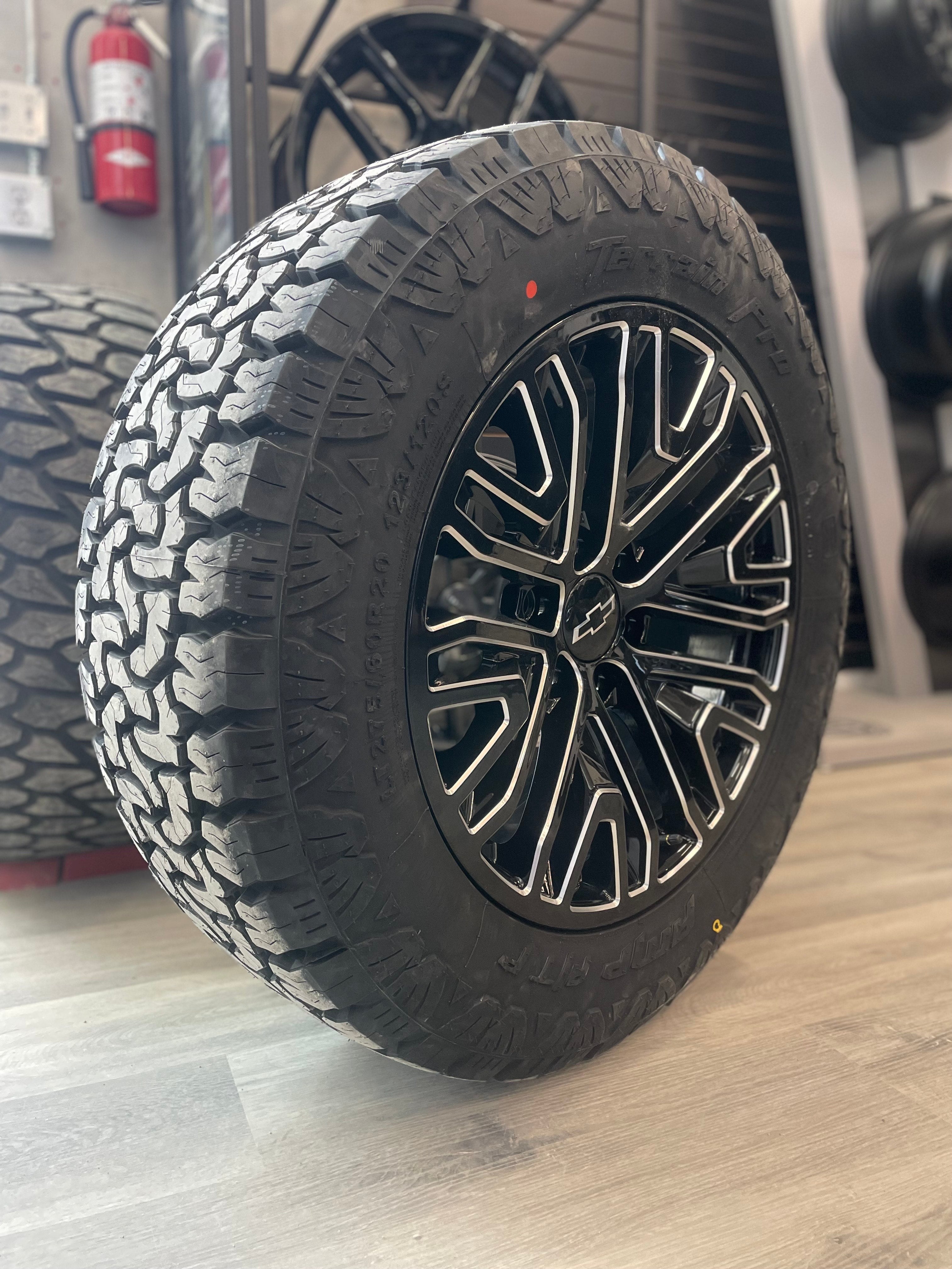 (SET OF FOUR) GMC Denali Replika Gloss BLK Milled 20x9 6x139.7 +24 | 275/60r20 Amp Terrain Pro