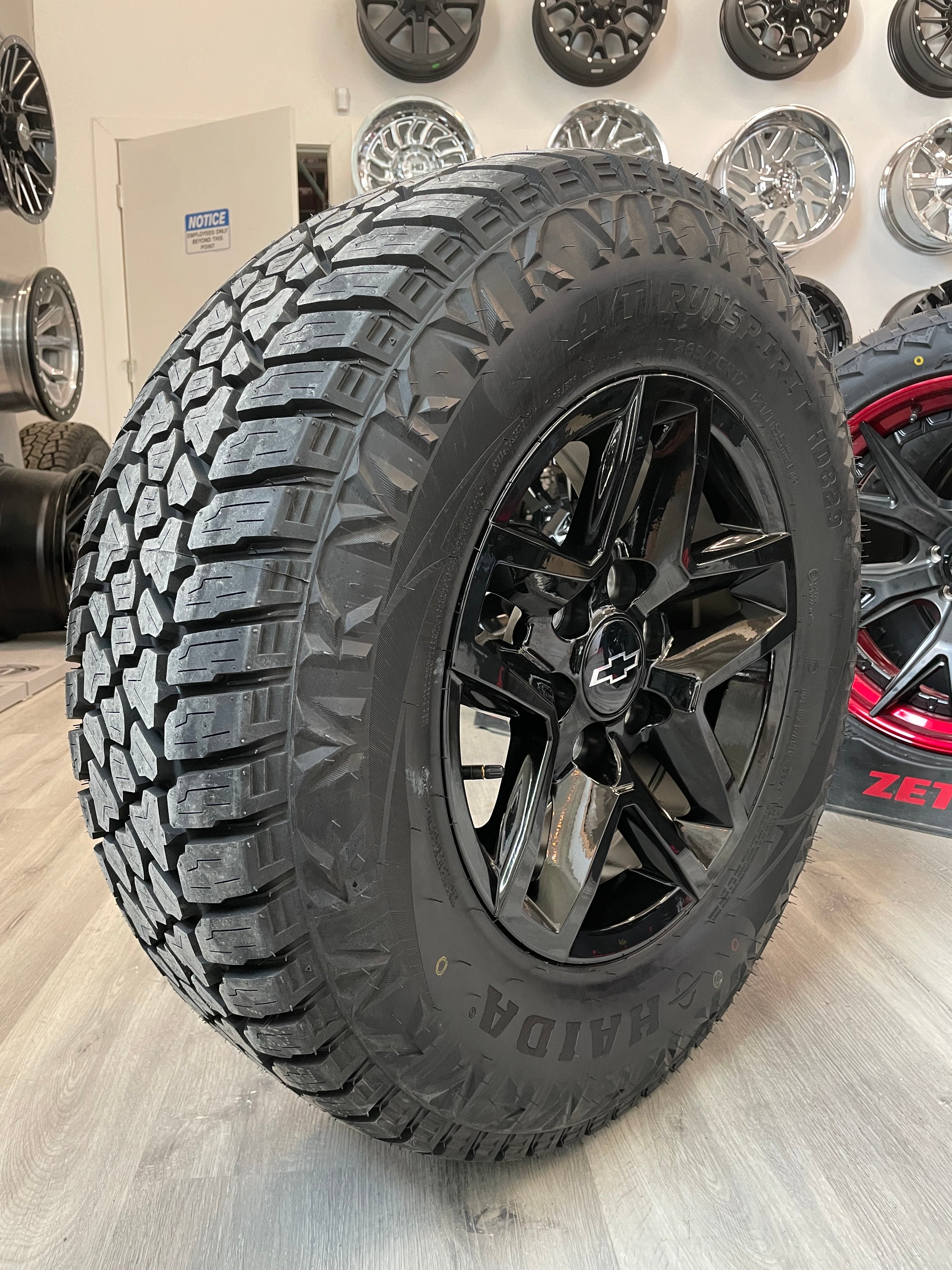 (SET OF FOUR) CHEVY TRAILBOSS OEM Reps 17x8 6x139.7 +24 Gloss BLK | 265/70r17 Haida 829 3PMS ( Sierra, Silverado, Ram )