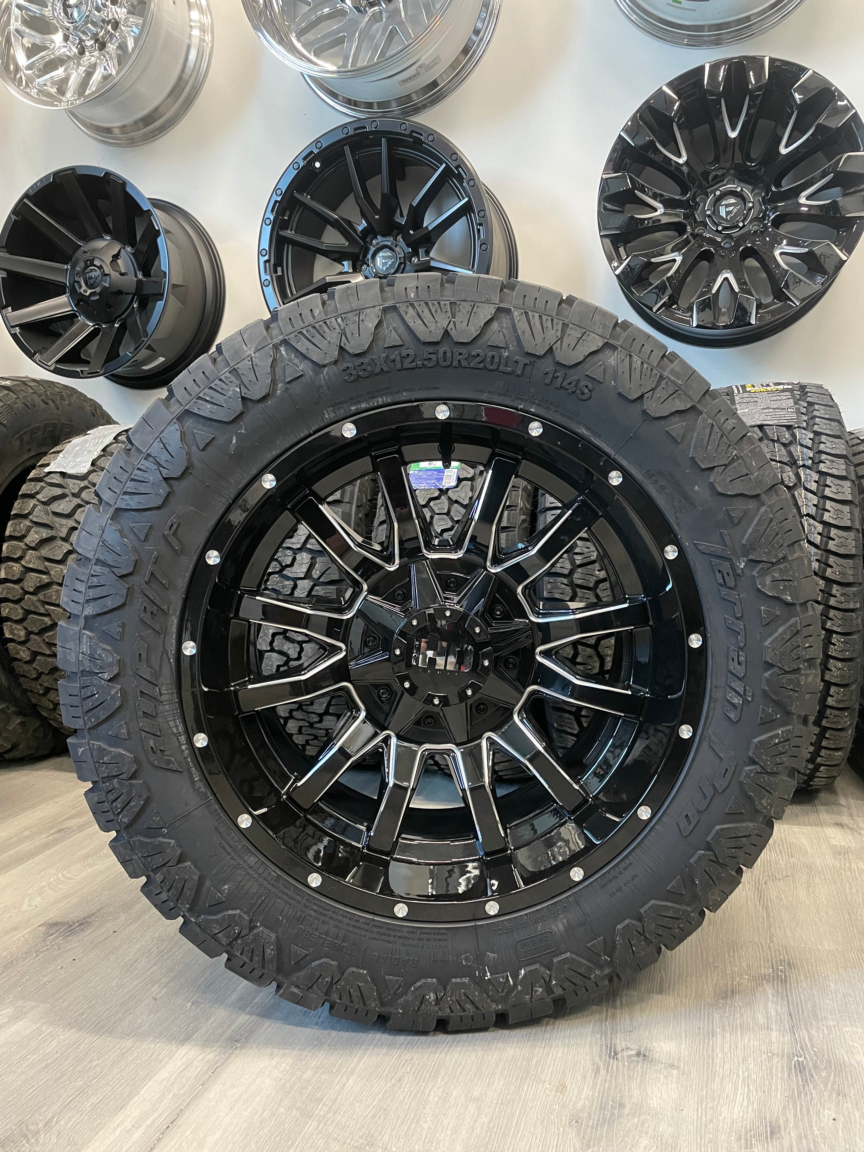 (SET OF FOUR) Fast Traxx 20x10 5x127/5x139.7 -15 BLK Milled | LT33x12.50r20 10 PLY Amp Terrain Pro AT ( RAM 1500/JEEP )