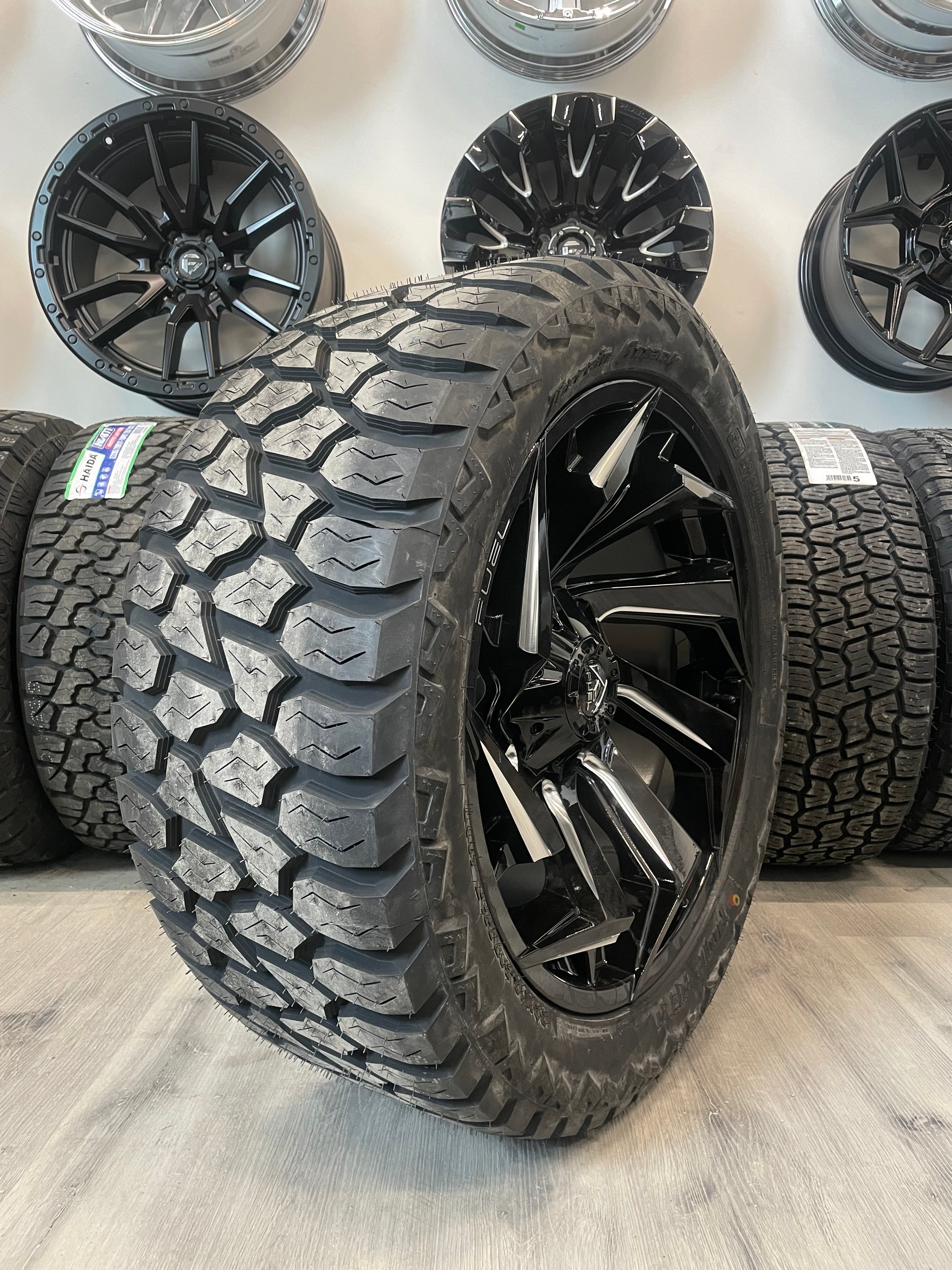 (SET OF FOUR) Fuel Reaction 22x10 5x139.7/5x150 -18 Gloss BLK Milled | LT33x12.50r22 Amp Attack AT