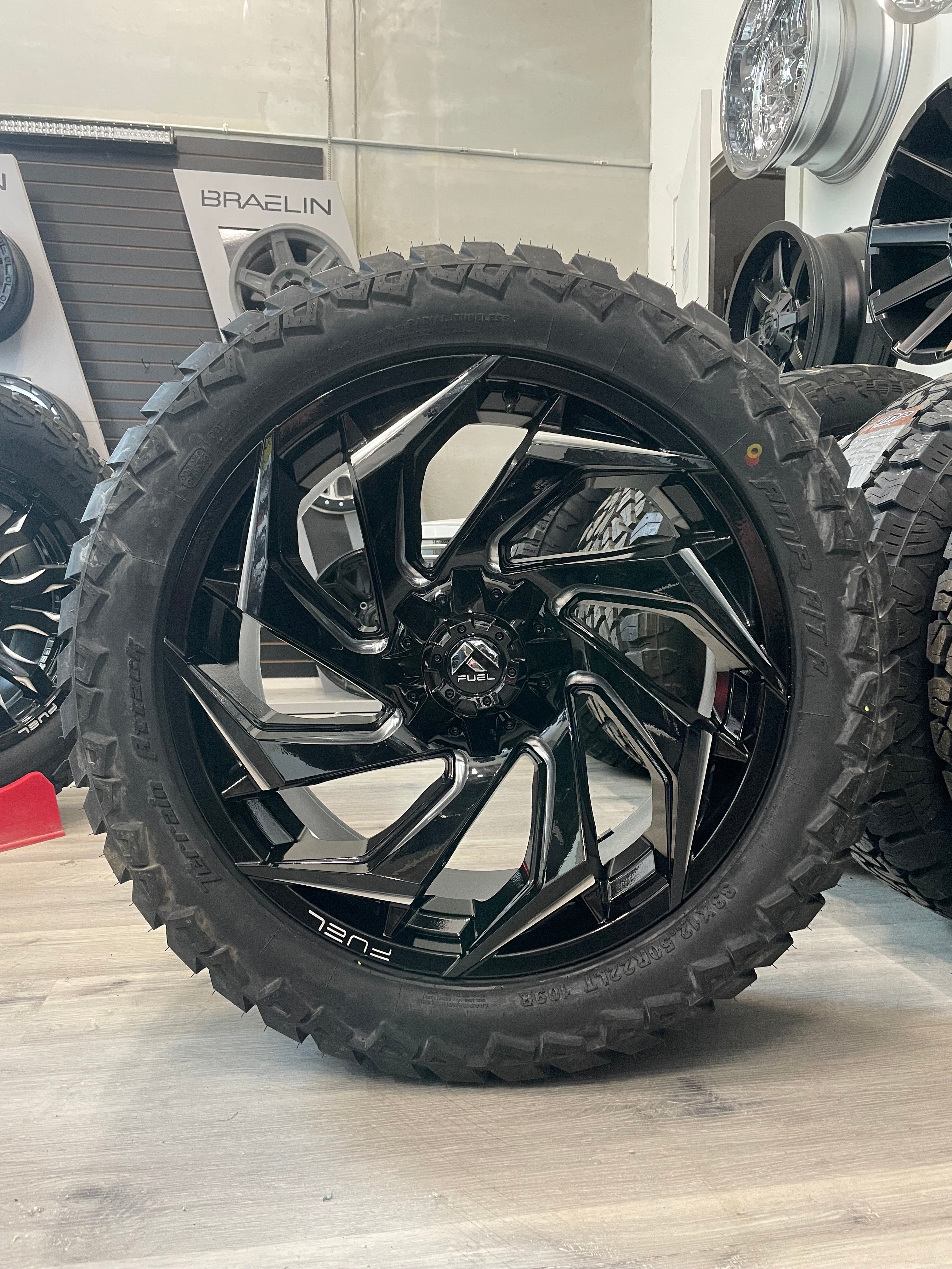 (SET OF FOUR) Fuel Reaction 22x10 5x139.7/5x150 -18 Gloss BLK Milled | LT33x12.50r22 Amp Attack AT