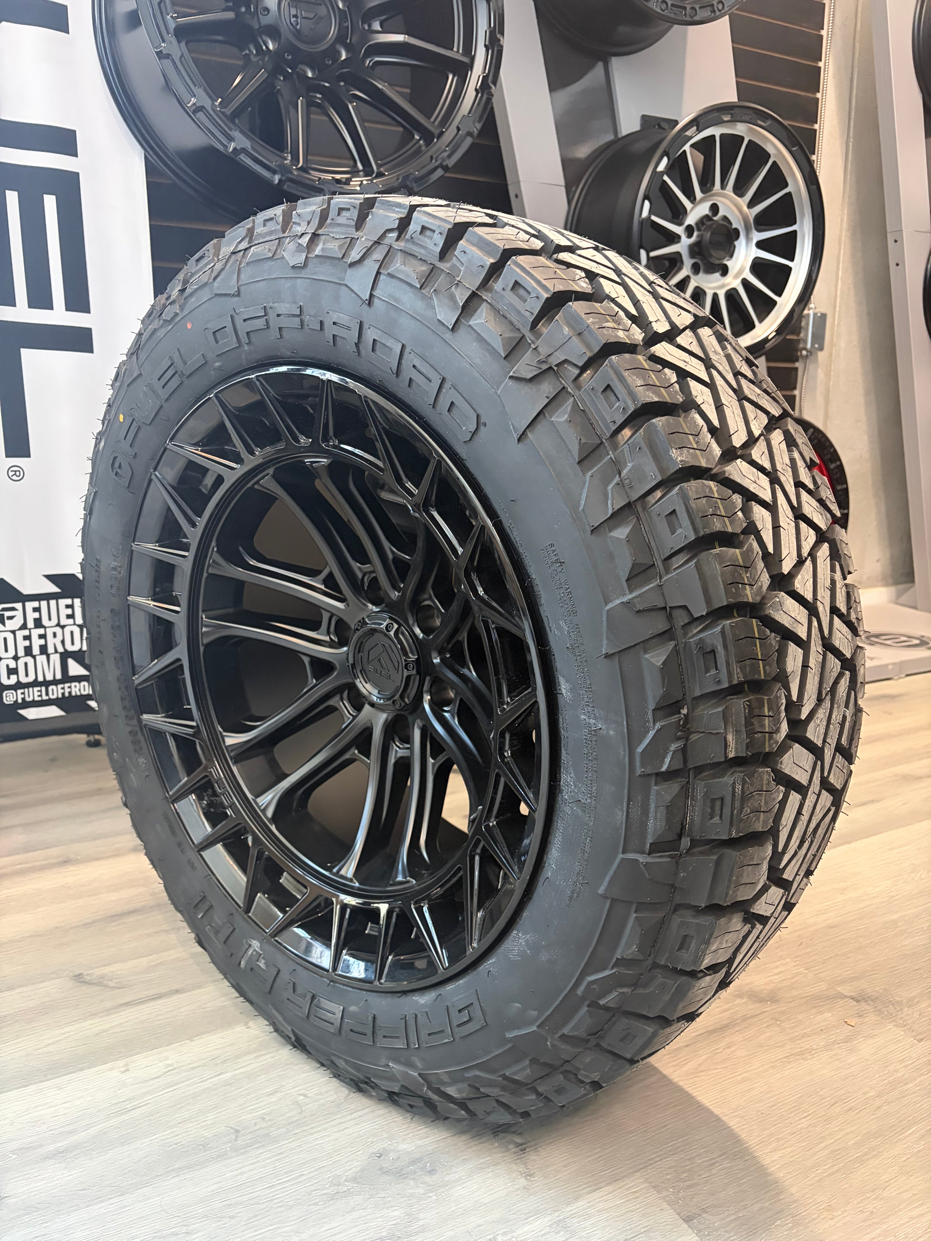 (SET OF FOUR) FUEL FC874 CELSIUS MATTE BLACK W/ GLOSS BLACK LIP 20X10 -18 6x139.7 106.1 | LT 285/55R20 Fuel Gripper AT II