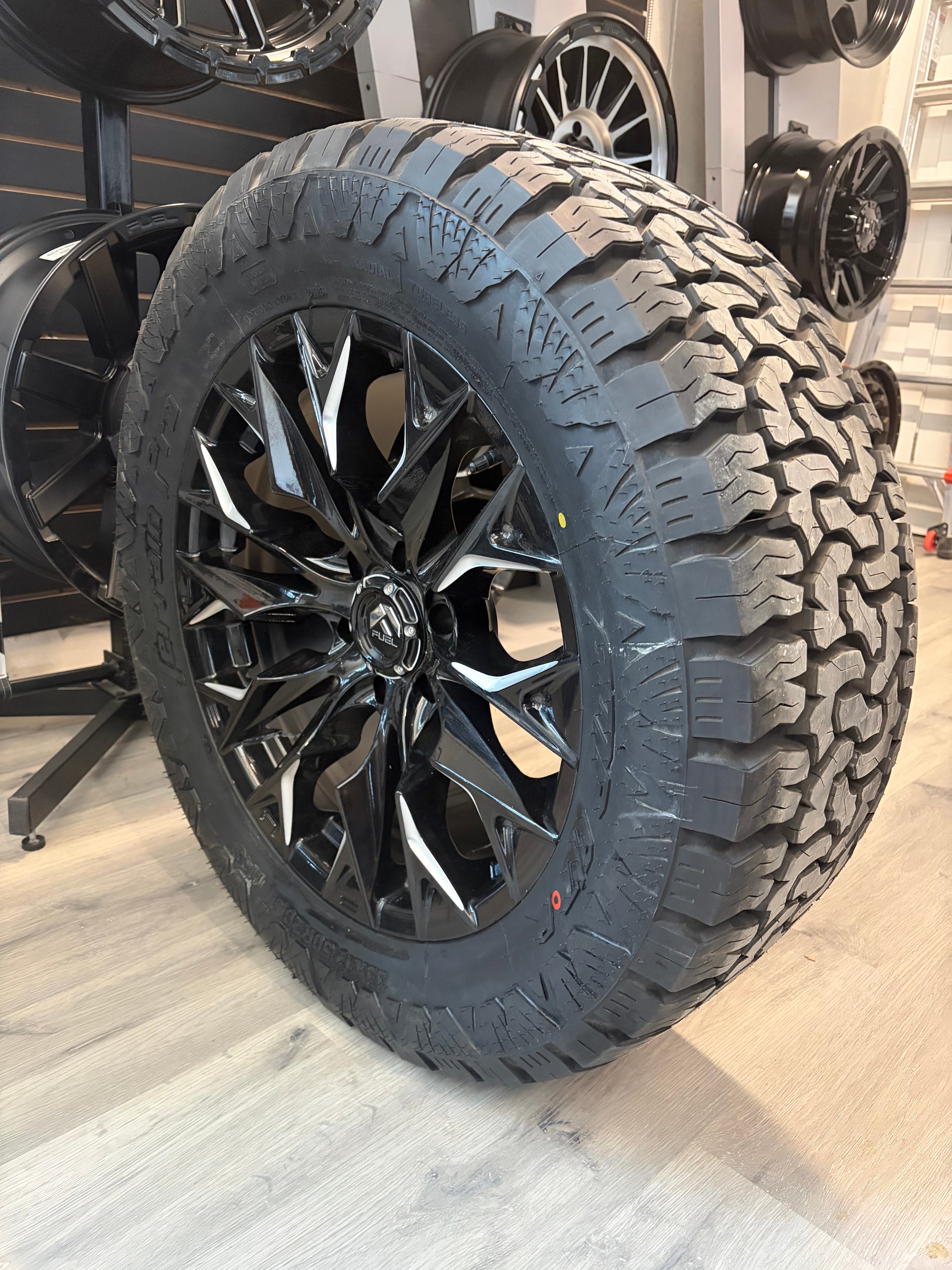 (SET OF FOUR) FUEL FLAME GLOSS BLACK MILLED 20X9 +20 6X135 87.1MM | 33X12.50r20 AMP PRO AT