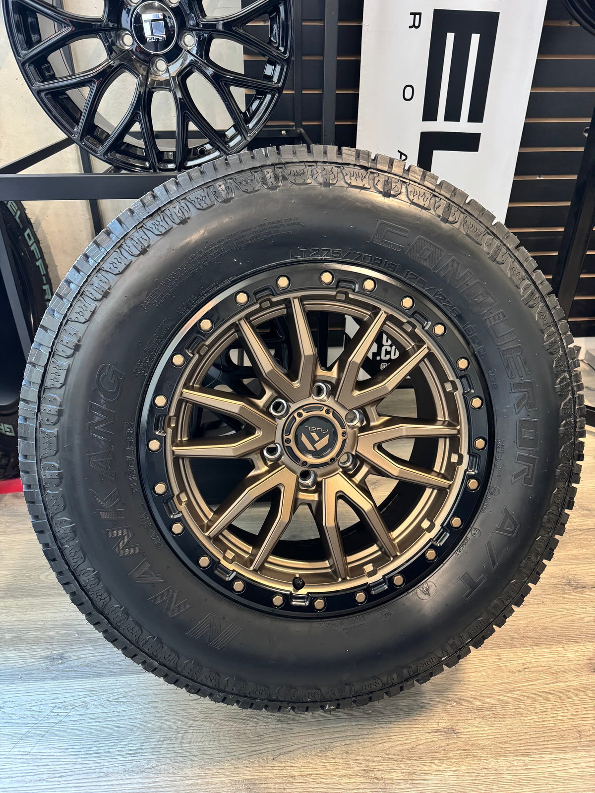 ( SET OF FOUR ) FUEL REBEL 18X9 +20 6X135 87.1 MATTE BRONZE BLACK BEAD RING | NANKANG AT-5 CONQUEROR A/T LT 275/70R18 125/122S E/10 OWL 3PMS