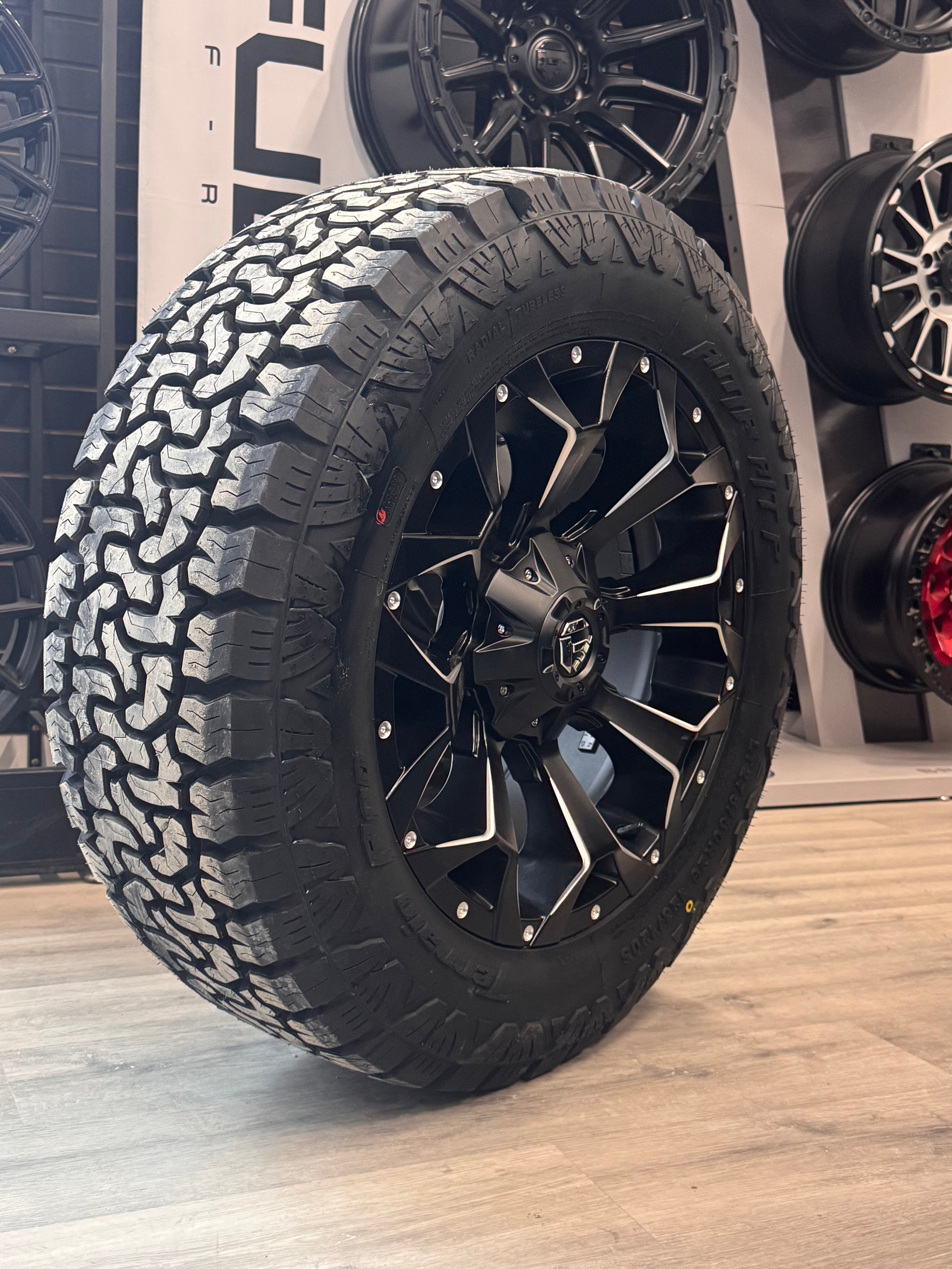 ( SET OF FOUR ) FUEL ASSAULT MATTE BLACK MILLED 20X9 +20 6X135/6X139.7 | LT 275/60R20 AMP TERRAIN PRO