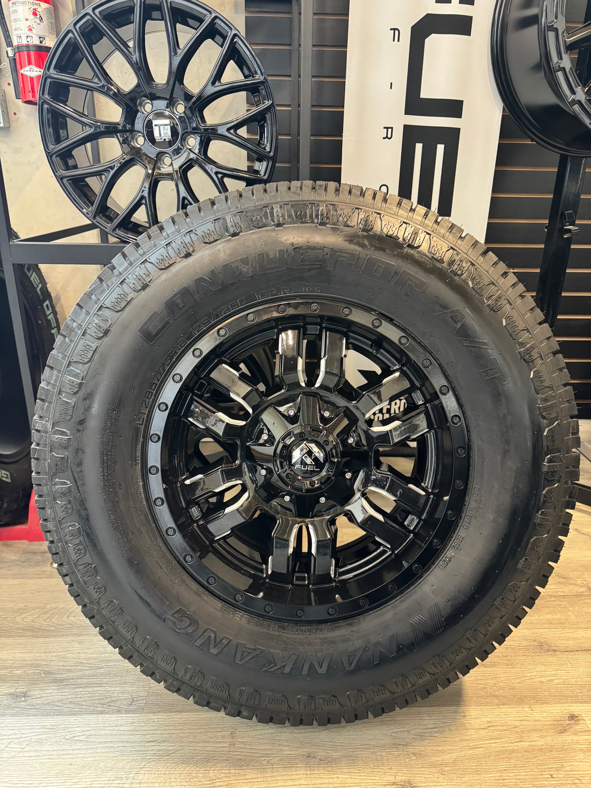 ( SET OF FOUR ) FUEL SLEDGE GLOSS BLACK MILLED 18X9 +20 8X165.1 125.1MM | NANKANG AT-5 CONQUEROR A/T LT 285/75R18 129/126Q E/10 3PMS