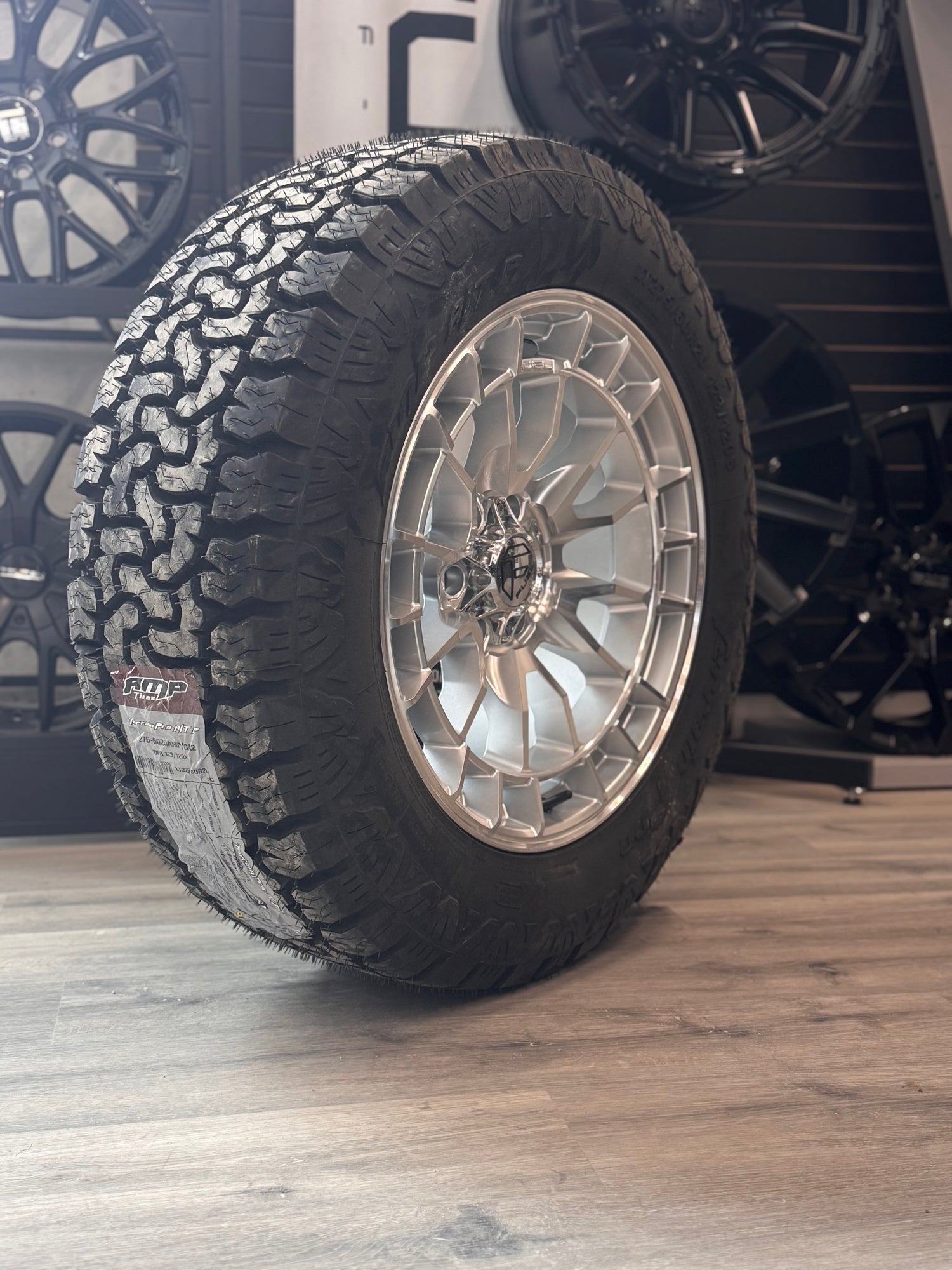 ( SET OF FOUR ) FUEL REVOLT 20X9 +1 6X135 87 HYPER SILVER W/ MACHINED FACE | LT 275/60R20 AMP TERRAIN PRO
