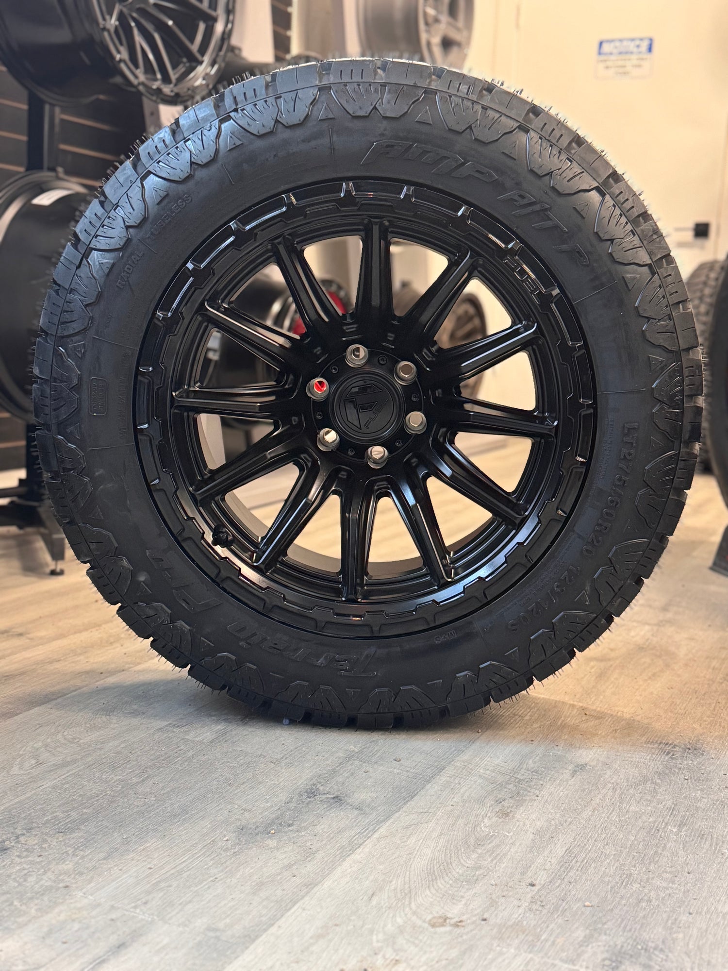 (SET OF FOUR) FUEL PISTON 20X10 -18 6X135 87 BLACKOUT W/ GLOSS BLACK LIP | 275/60R20 AMP TERRAIN PRO