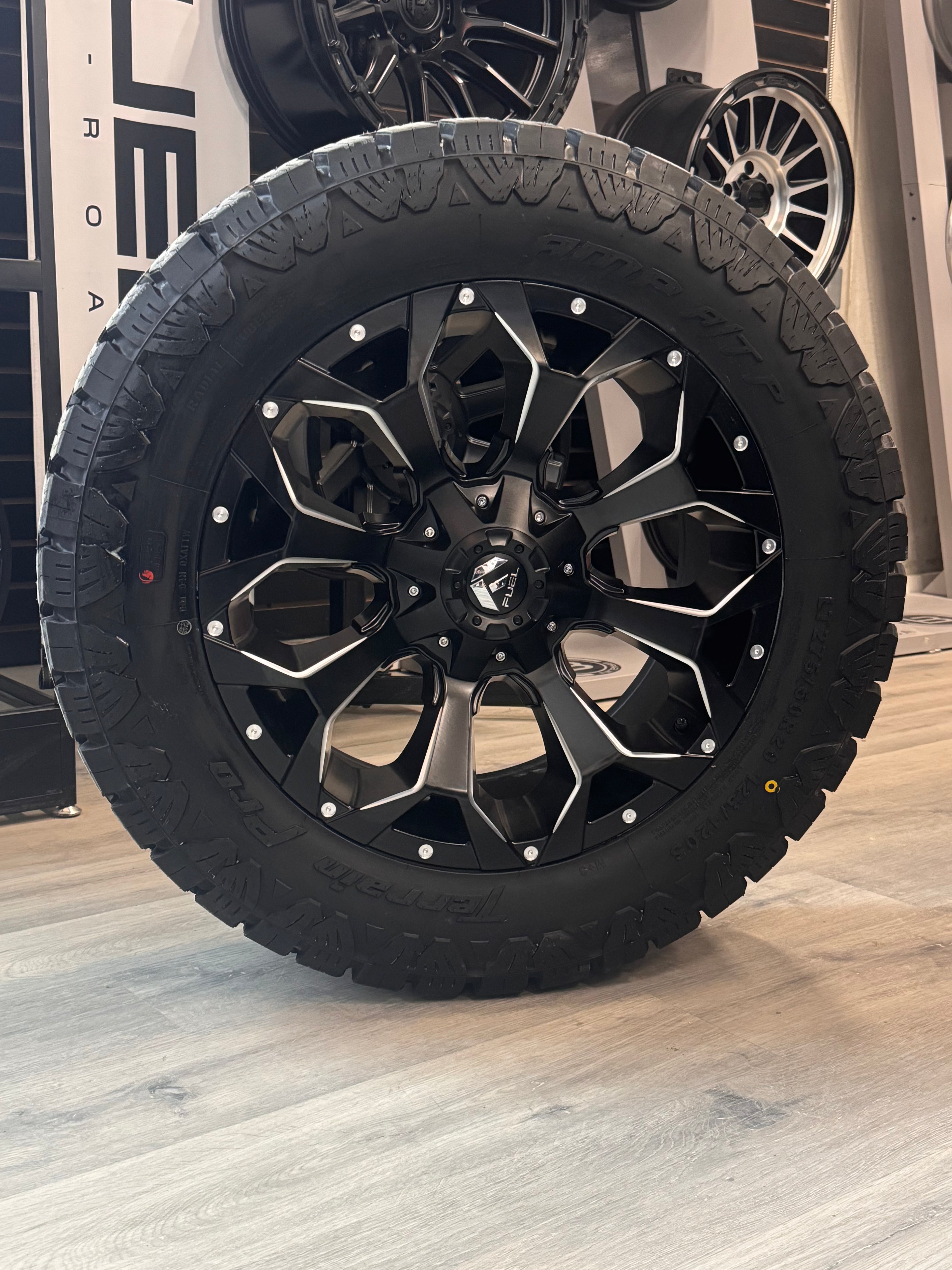 ( SET OF FOUR ) FUEL ASSAULT MATTE BLACK MILLED 20X9 +20 6X135/6X139.7 | LT 275/60R20 AMP TERRAIN PRO