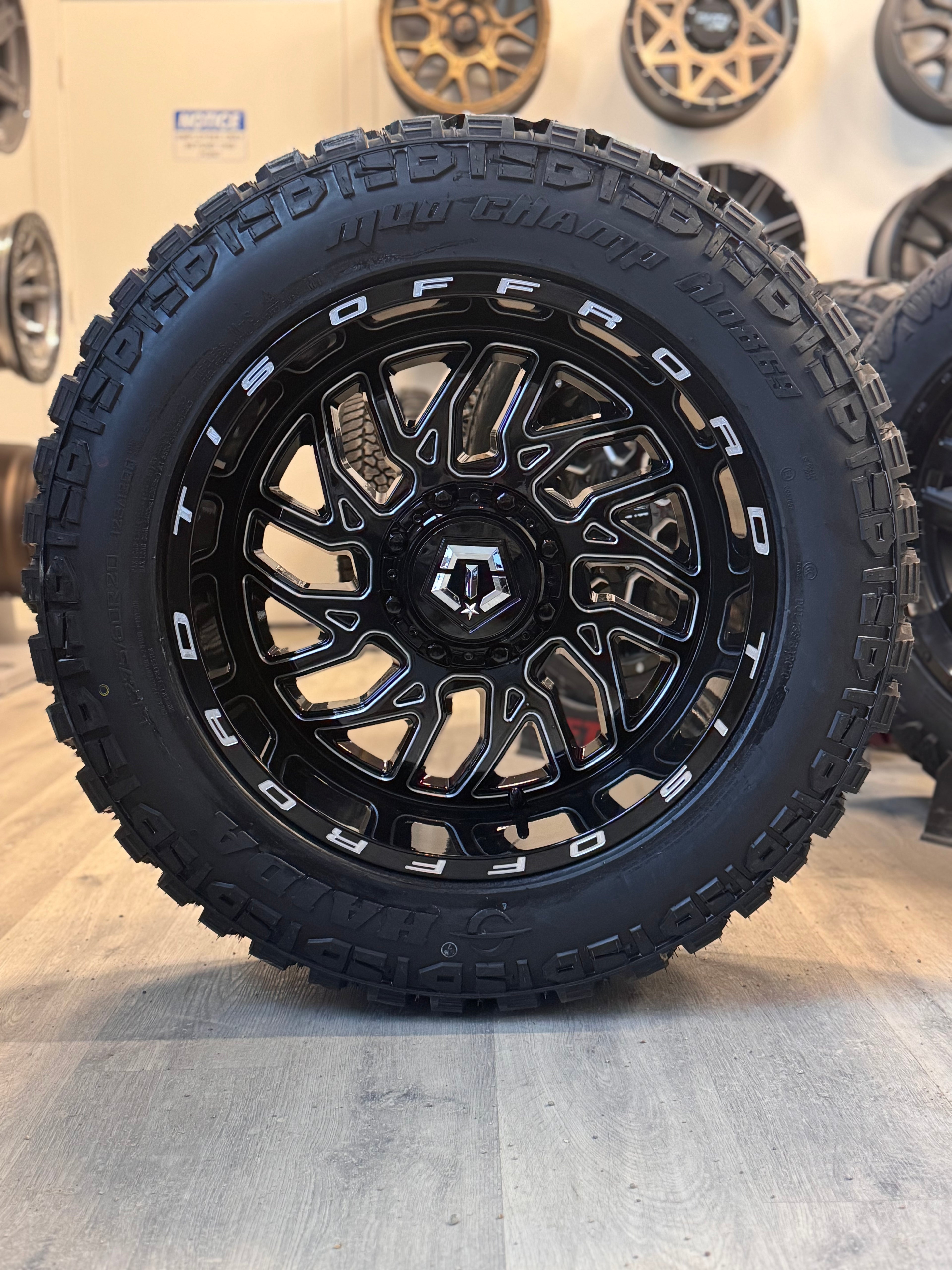 (SET OF FOUR) TIS 544 GLOSS BLACK - MILLED EDGE 20X10.0 -25 6X135/6X139.7MM 108.1MM | 275/60R20 HAIDA 869 MUD CHAMP 3PMS