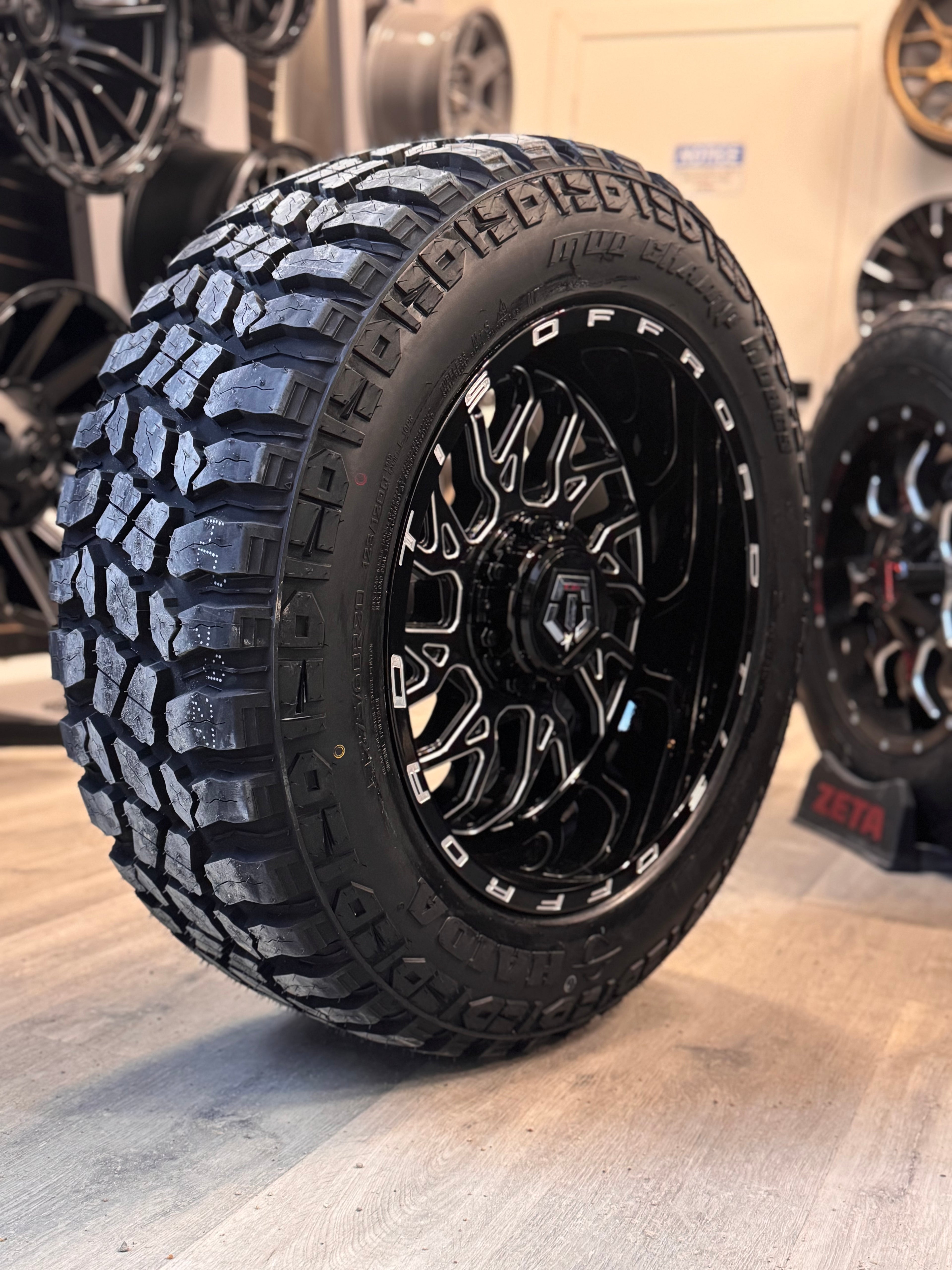 (SET OF FOUR) TIS 544 GLOSS BLACK - MILLED EDGE 20X10.0 -25 6X135/6X139.7MM 108.1MM | 275/60R20 HAIDA 869 MUD CHAMP 3PMS