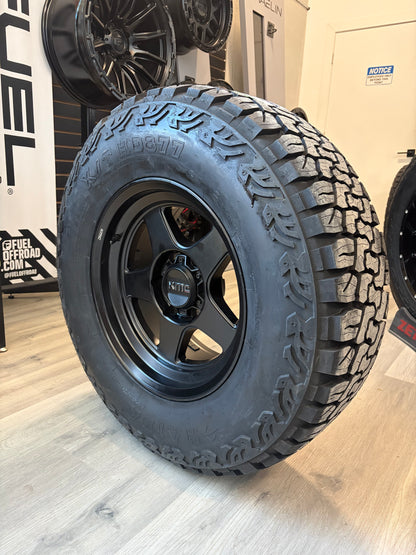 (SET OF FOUR) KMC LOBO 17X8.5 -10 6X139.7 106 MATTE BLK | HAIDA HD 877 LT 285/70R17 (10PLY)