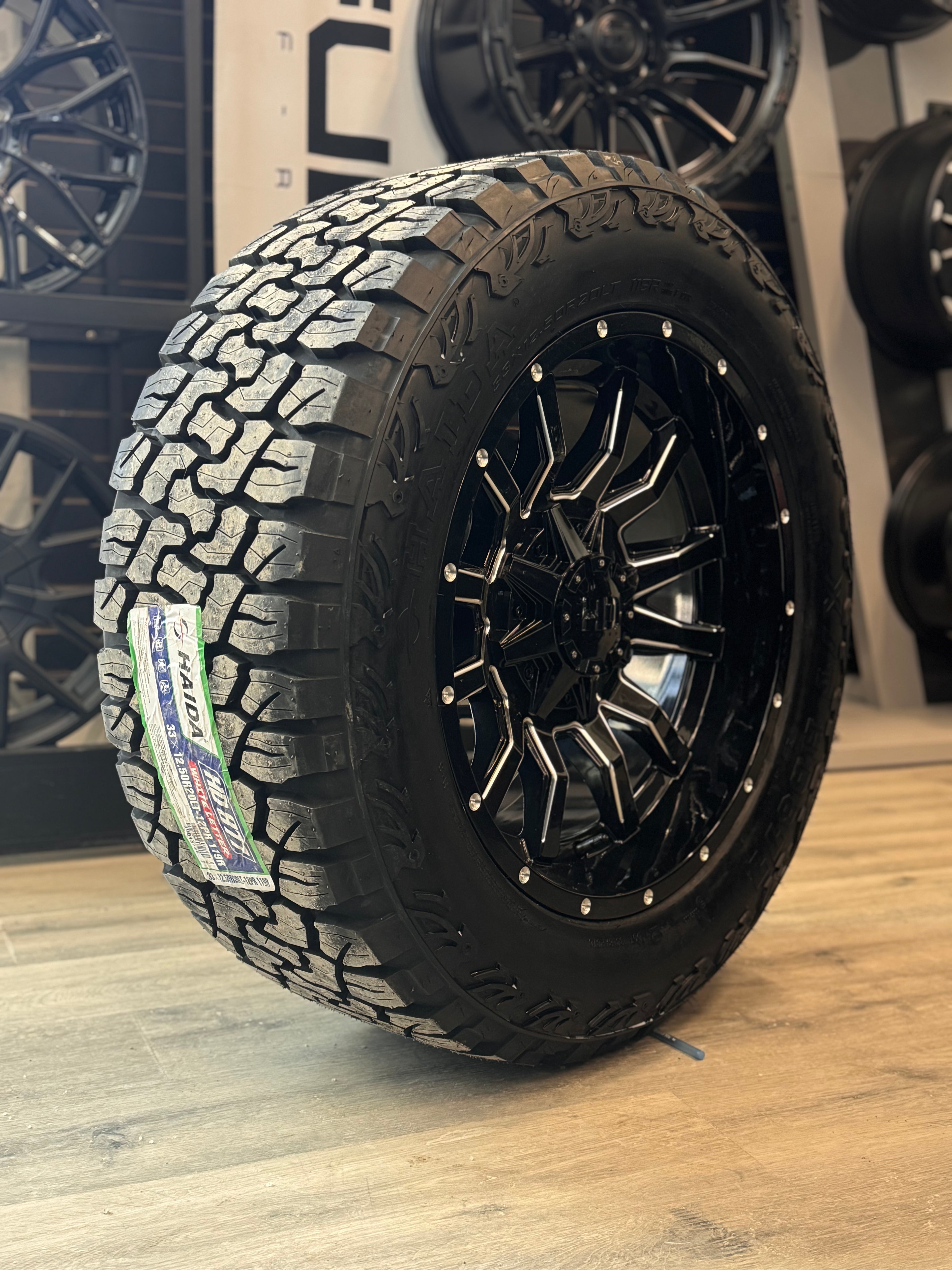 (SET OF FOUR) FAST HD TRAXX GLOSS BLACK MILLED 20X10 -18 6X135/6X139.7MM 95.1MM | LT 33X12.50R20 HAIDA XT 877 3PMS