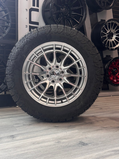 ( SET OF FOUR ) FUEL REVOLT 20X9 +1 6X135 87 HYPER SILVER W/ MACHINED FACE | LT 275/60R20 AMP TERRAIN PRO