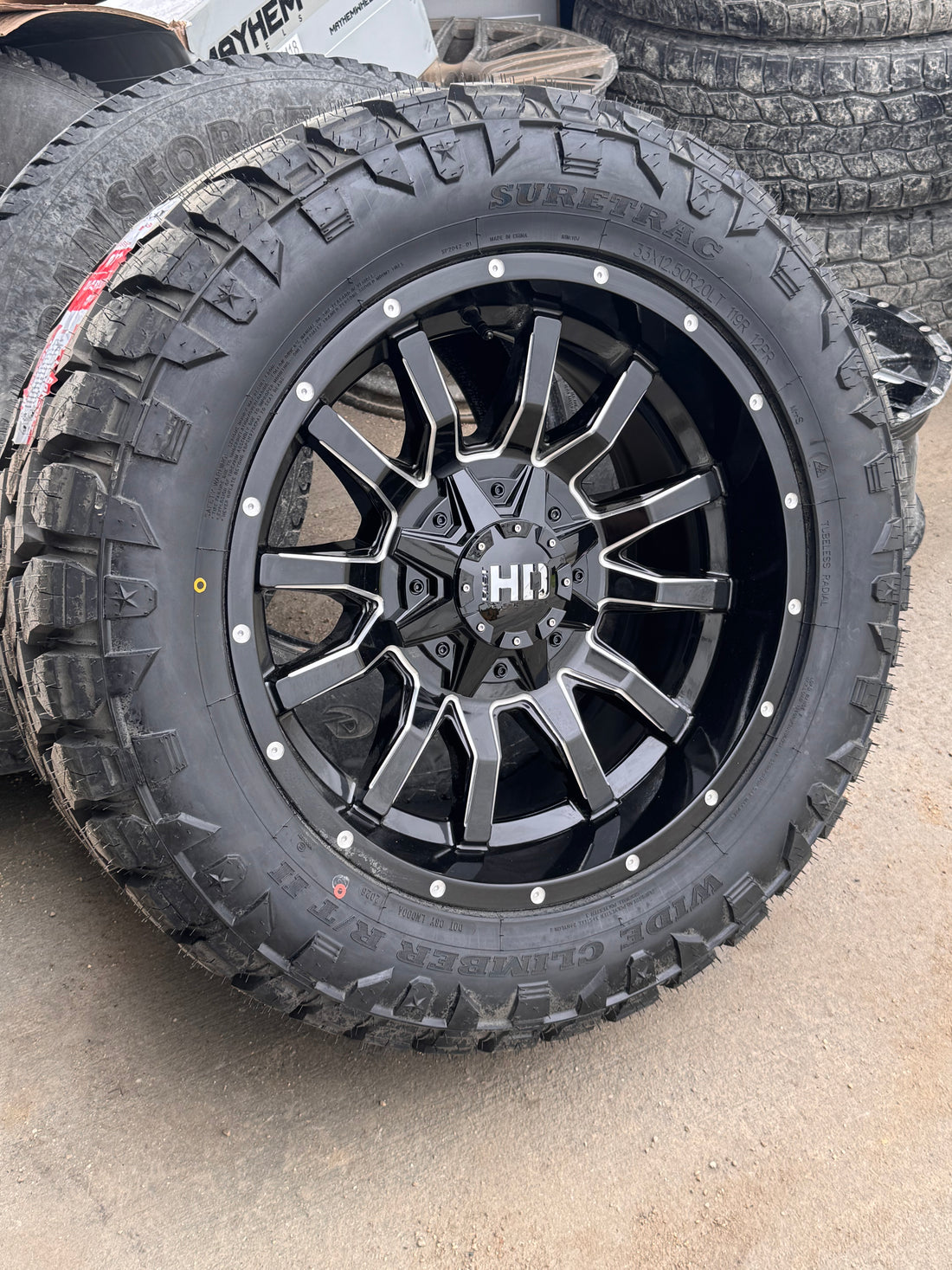 ( SET OF FOUR ) FAST HD TRAXX GLOSS BLACK MILLED 20X10 -18 6X135/6X139.7MM 95.1MM | SURETRAC R/T 2 WIDE CLIMBER LT 33X12.50R20 3PMS 12PLY