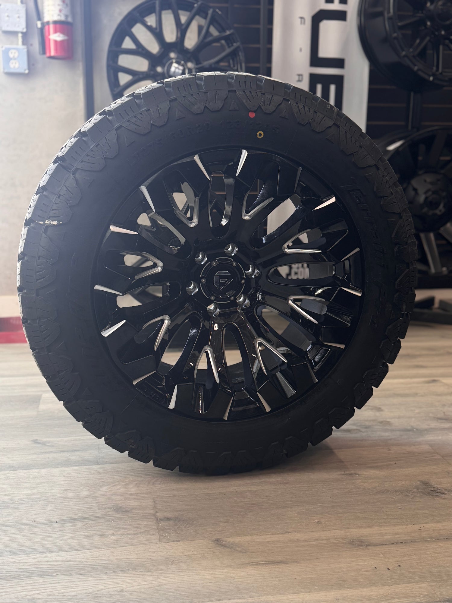(SET OF FOUR) FUEL QUAKE 20X10 6X135 -18 GLOSS BLACK MILLED | LT 275/60R20 AMP TERRAIN PRO