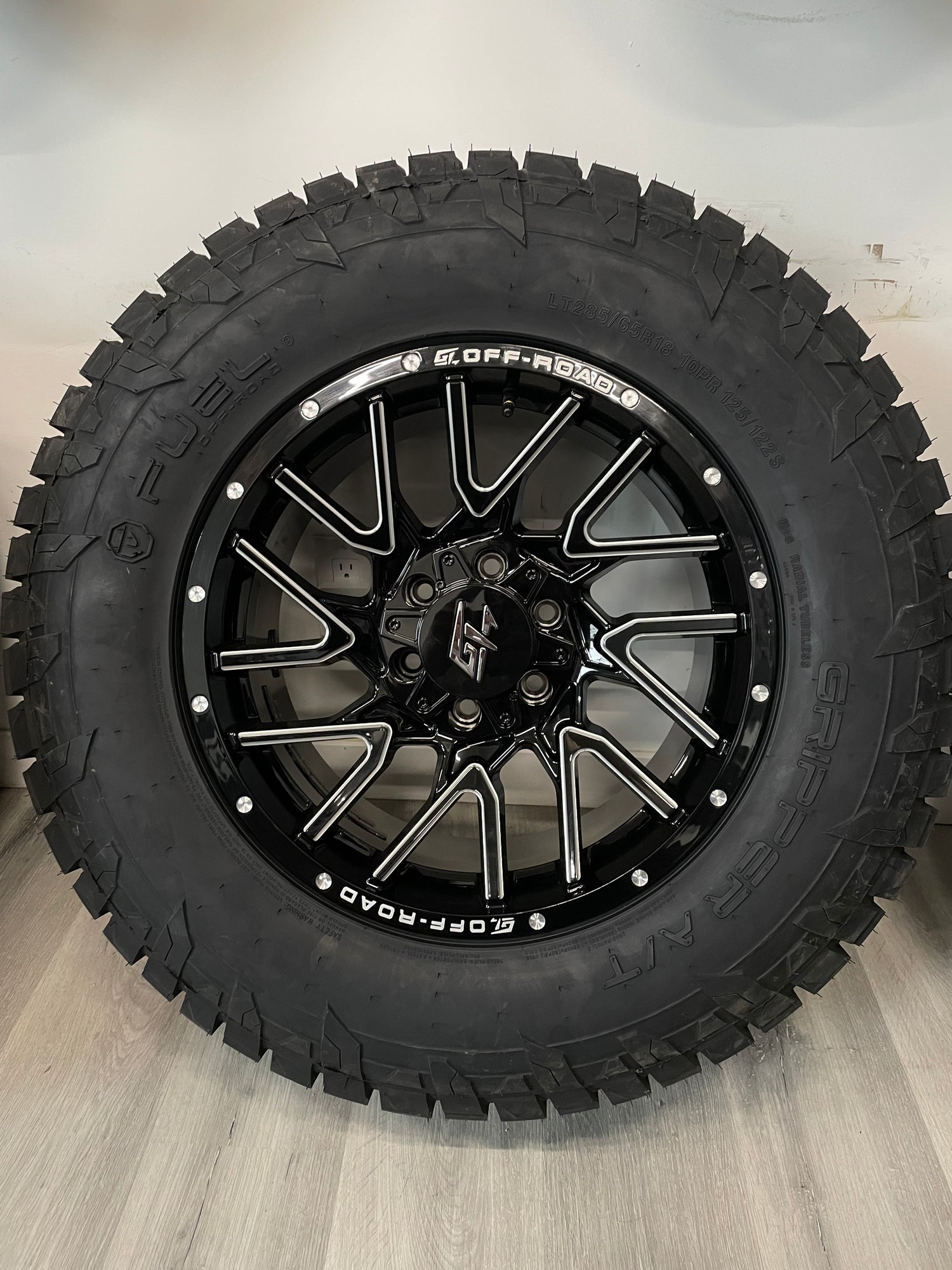 (SET OF FOUR) GT Off-road Aggression GLOSS BLACK MILLED 18x9 6x135/139.7 +12 | FUEL Gripper A/T 285/65R18