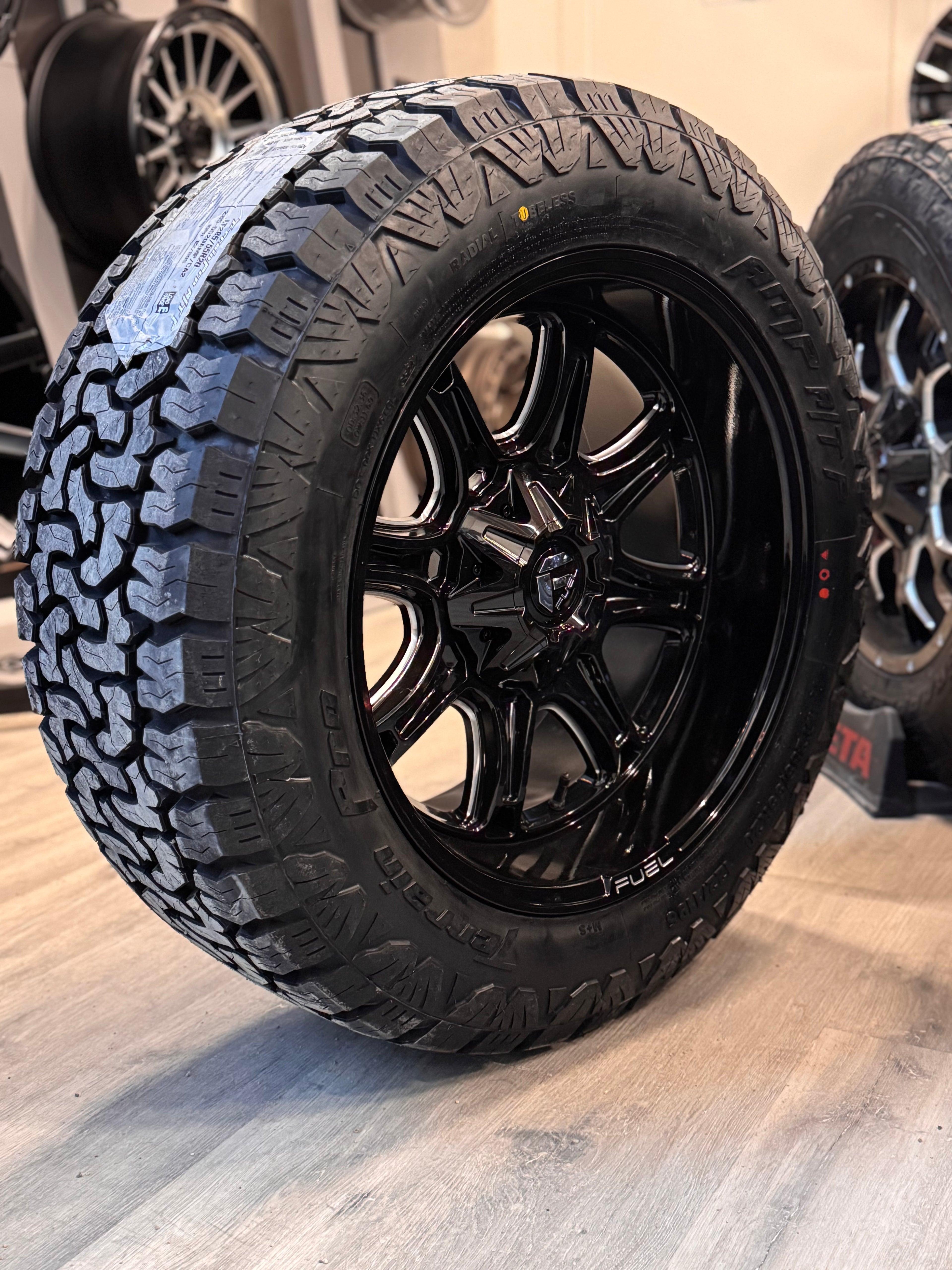 (SET OF FOUR) FUEL DARKSTAR GLOSS BLK MILLED 20X10 6X135/6X139.7 -18 106.1MM | 285/55R20 AMP TERRAIN PRO