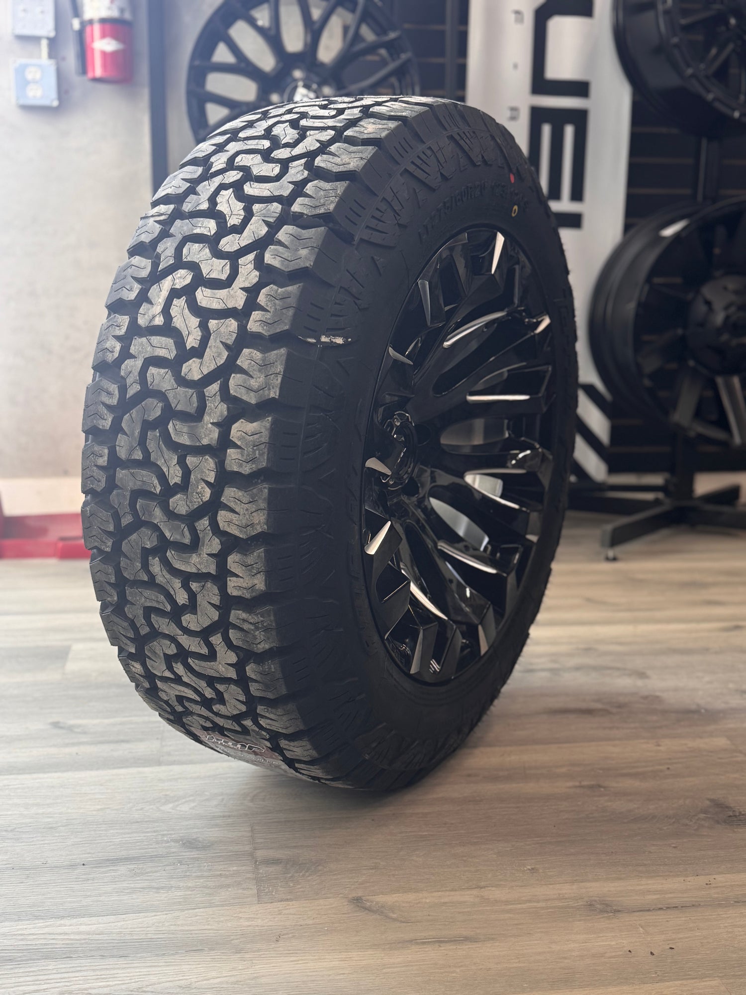 (SET OF FOUR) FUEL QUAKE 20X10 6X135 -18 GLOSS BLACK MILLED | LT 275/60R20 AMP TERRAIN PRO