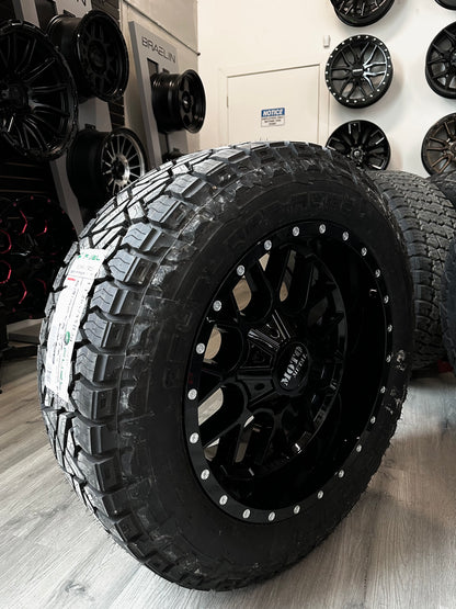 ( SET OF FOUR ) MOTO METAL MO986 GLOSS BLACK 20X10 6X135/6X139.7 -18 | 285/55R20 LT FUEL GRIPPER AT2