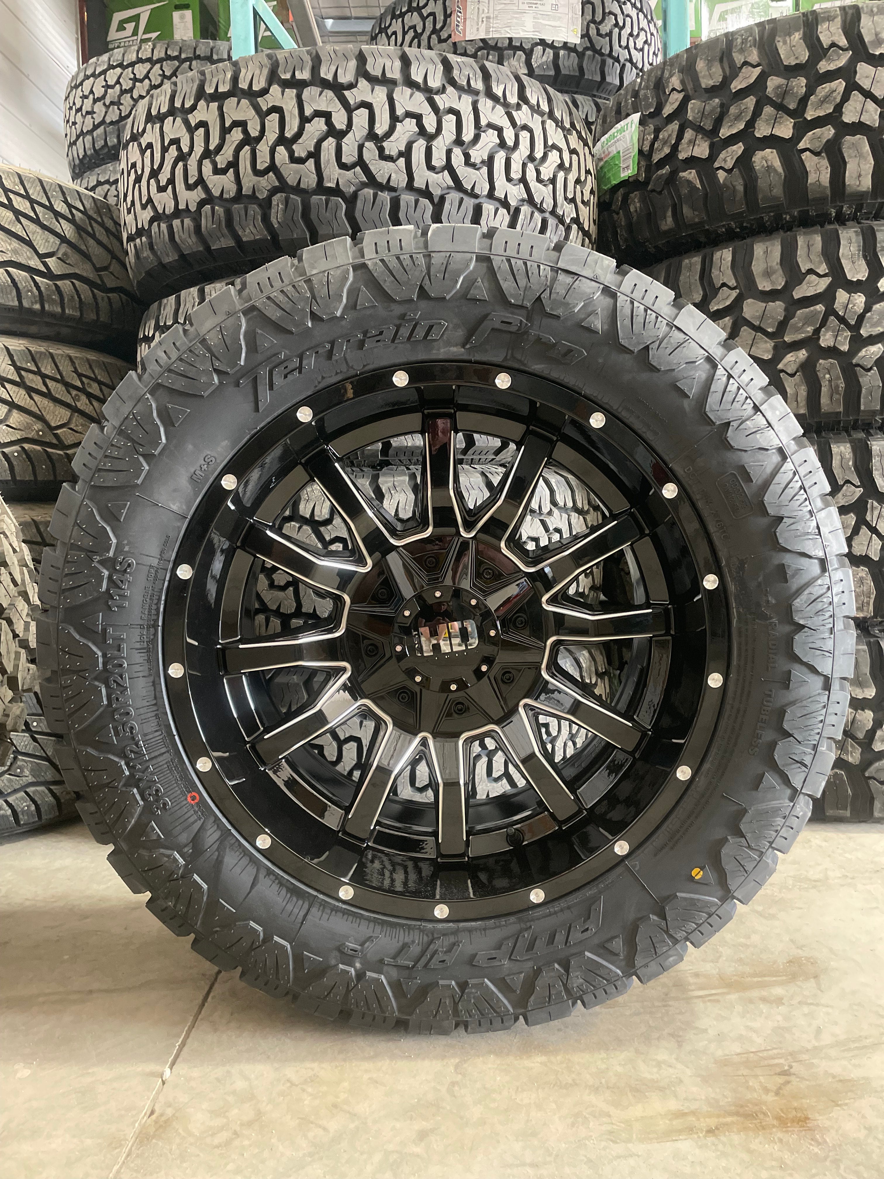 (SET OF FOUR) Fast Traxx 20x10 6x135/6x139.7 -18 Gloss BLK Milled | 33x12.50r20 Amp Terrain Pro