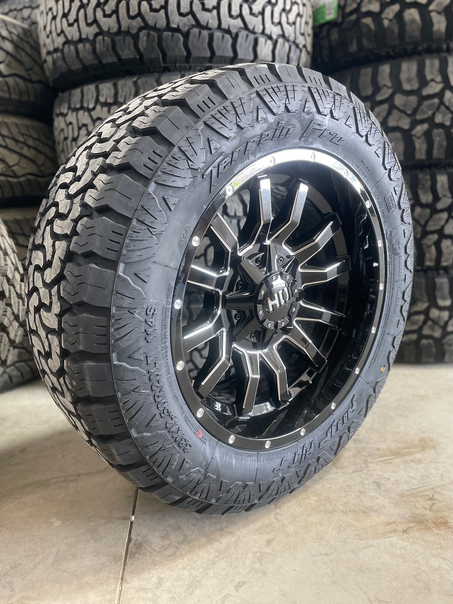 (SET OF FOUR) Fast Traxx 20x10 6x135/6x139.7 -18 Gloss BLK Milled | 33x12.50r20 Amp Terrain Pro