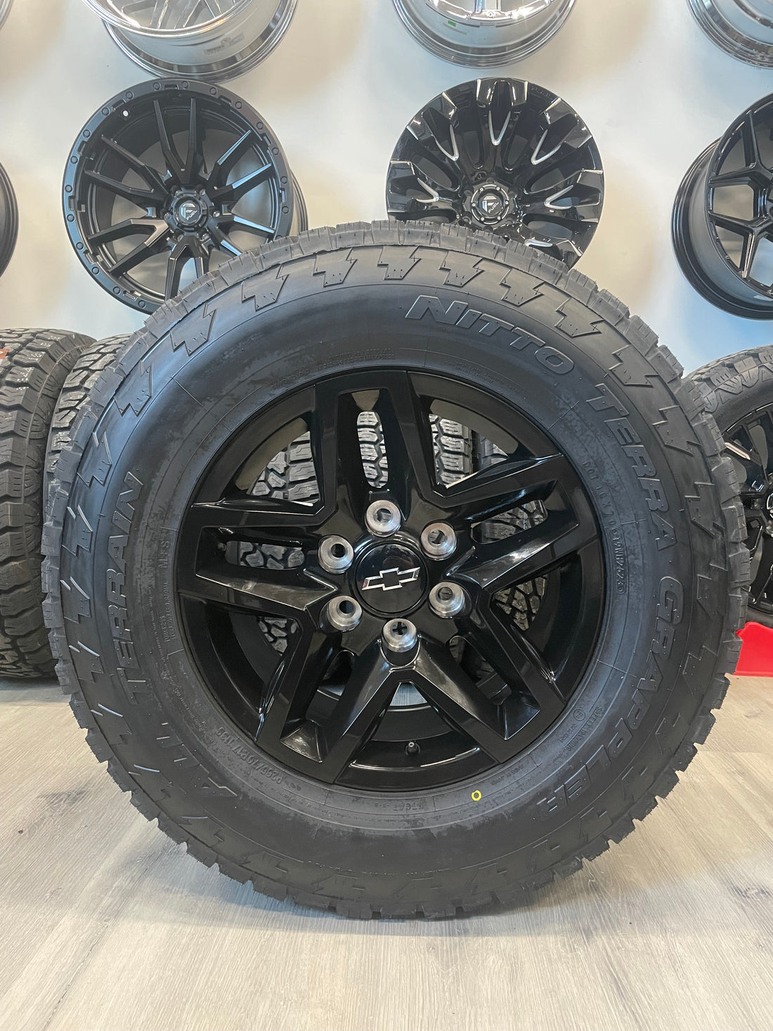(SET OF FOUR) CHEVY/GMC TRAILBOSS OEM R245 17x8 6x139.7 +24 Gloss BLK | 265/70r17 NITTO TERRA GRAPPLER  ( Sierra, Silverado, Yukon, Tahoe )