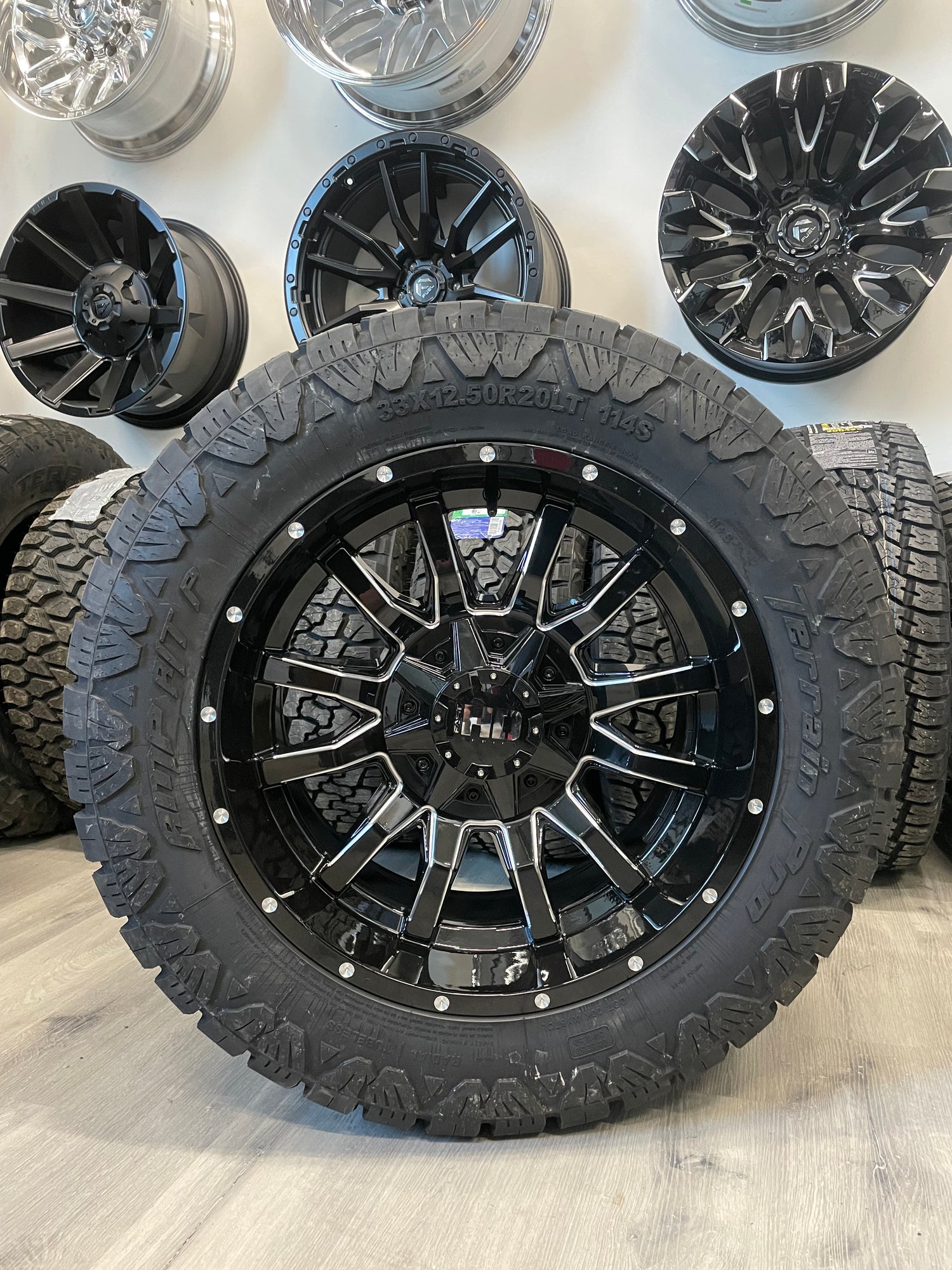 (SET OF FOUR) Fast Traxx 20x10 5x127/5x139.7 -15 BLK Milled | LT33x12.50r20 10 PLY Amp Terrain Pro AT ( RAM 1500/JEEP )