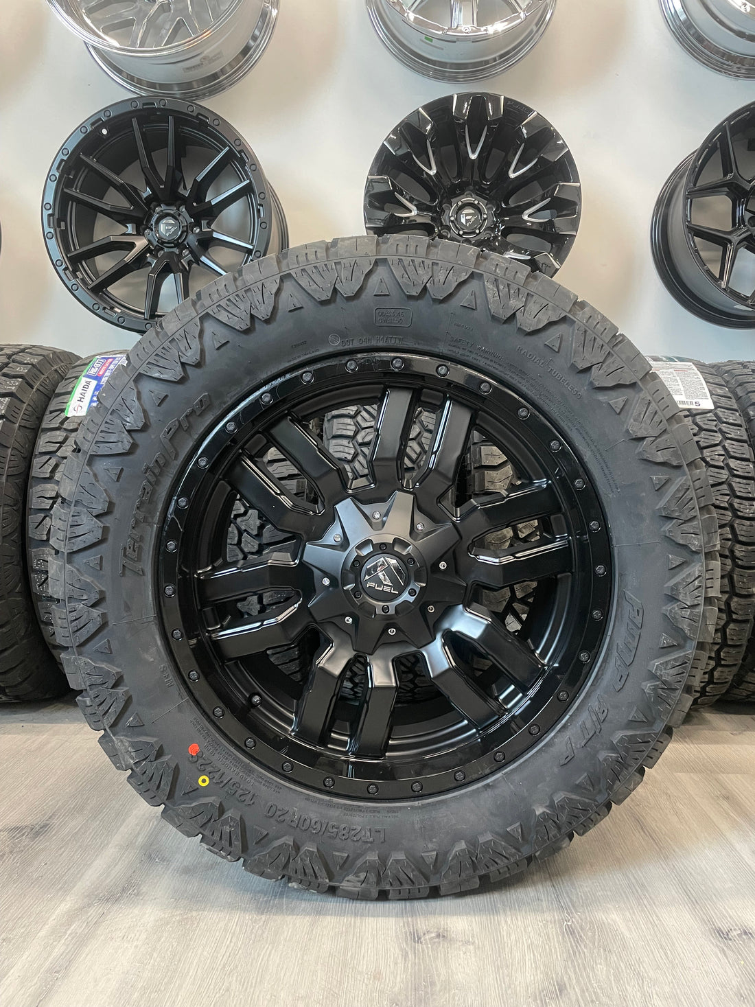 (SET OF FOUR) Fuel Sledge 20x9 8x180 +20 Matte BLK/Gloss BLK Lip | LT285/60r20 Amp Terrain Pro