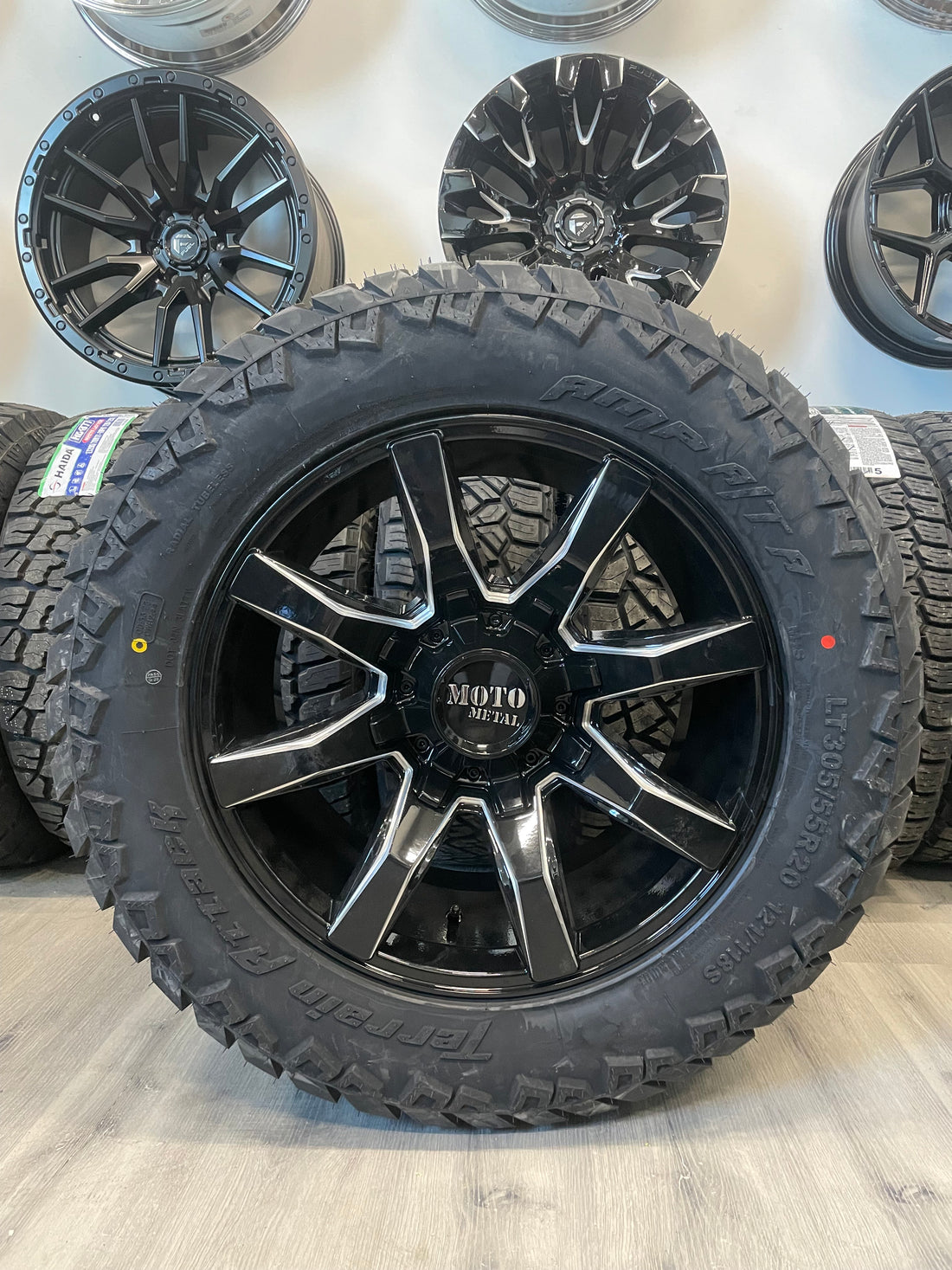 (SET OF FOUR) Moto Metal MO804 20x10 8x165.1 -18 Gloss BLK Milled | LT305/55r20 Amp Attack AT