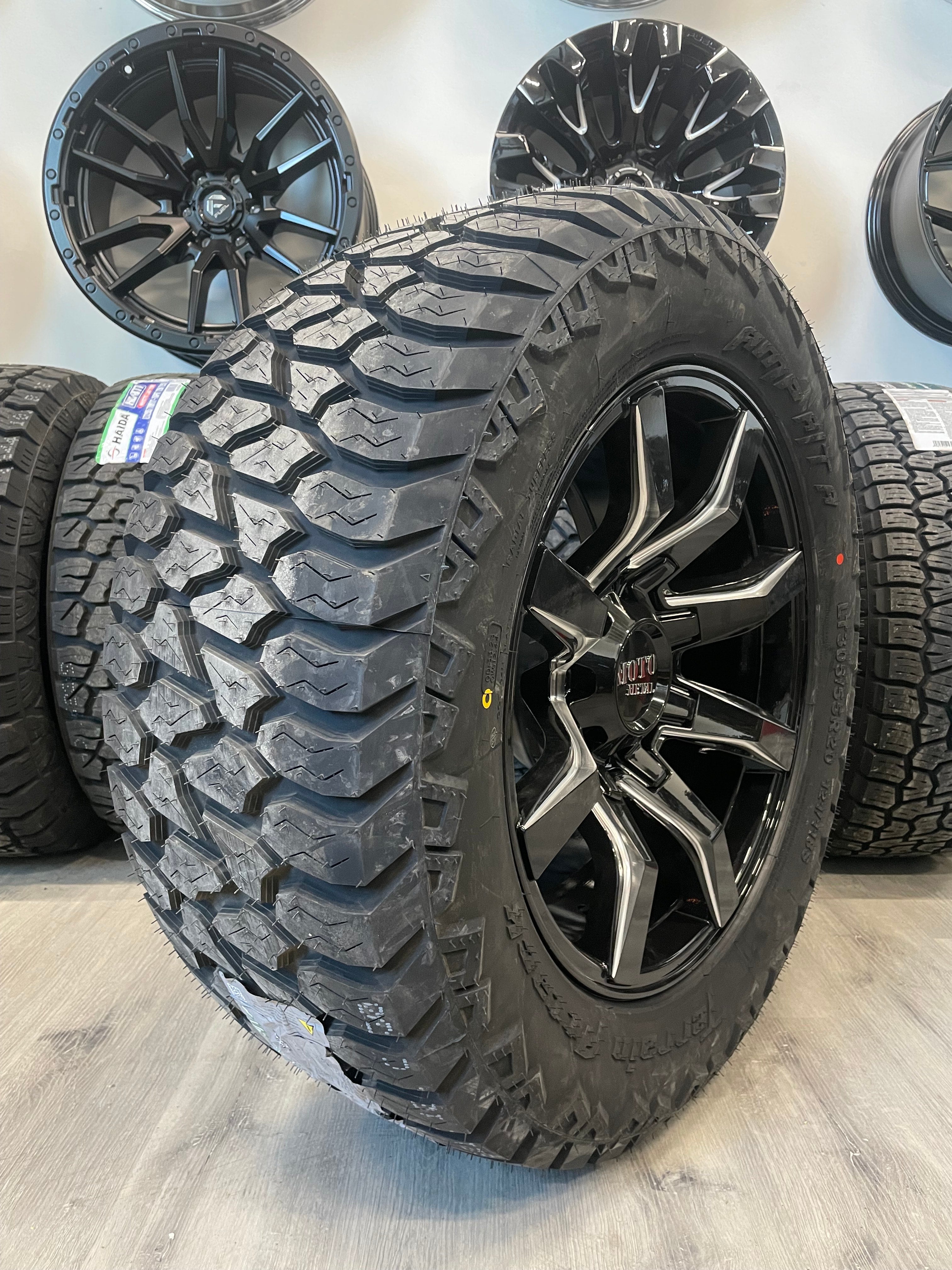 (SET OF FOUR) Moto Metal MO804 20x10 8x165.1 -18 Gloss BLK Milled | LT305/55r20 Amp Attack AT
