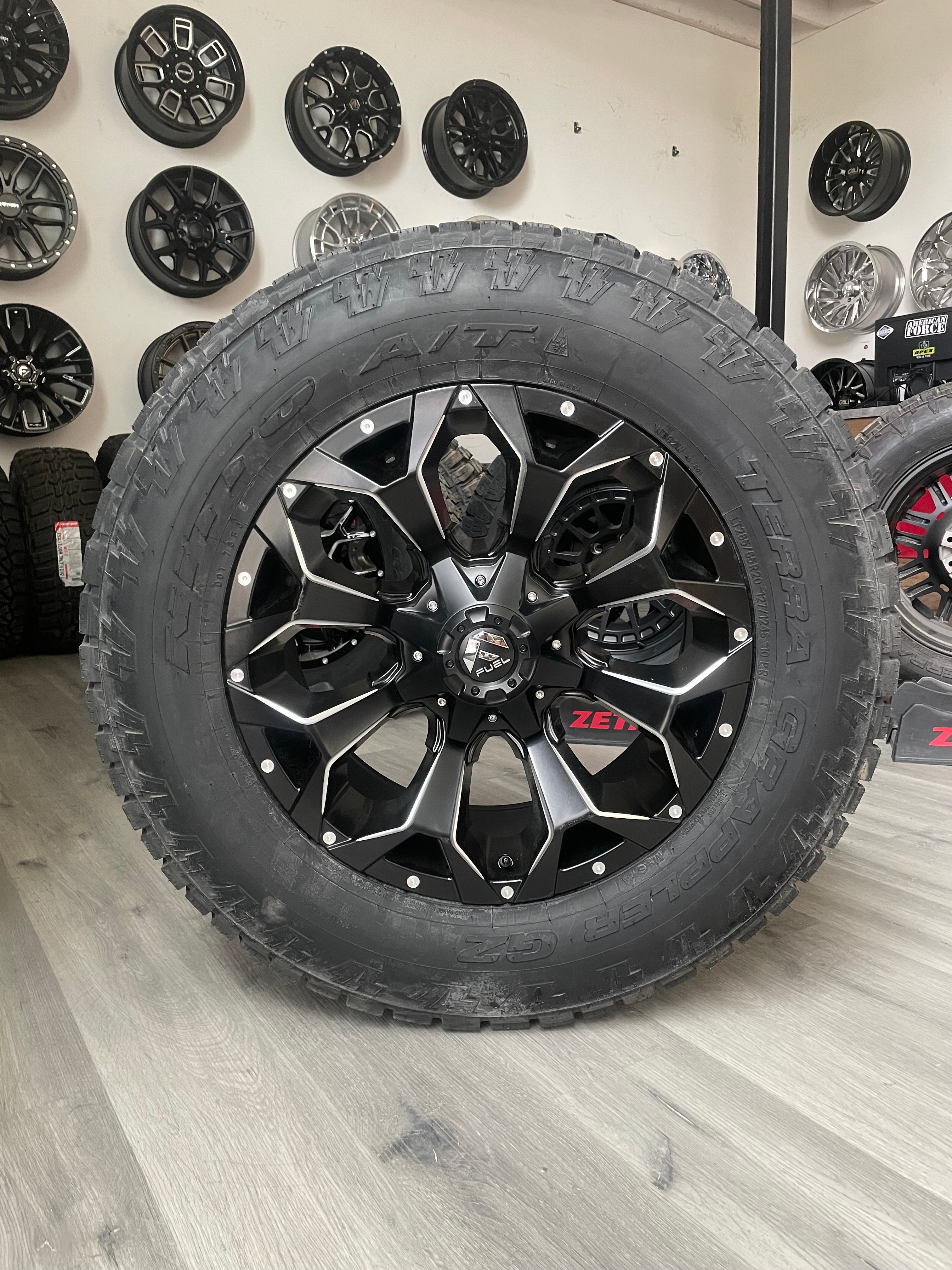 ( SET OF FOUR ) FUEL ASSAULT GLOSS BLACK MILLED 20X9 +20 8X180 | 285/65R20 NITTO TERRA GRAPPLER G2 3PMS