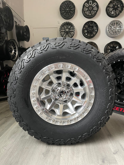 (SET OF FOUR) FUEL COVERT SILVER/MACHINED 17X8.5  6X139.7 0MM 106.1MM | 285/70R17 HAIDA 877