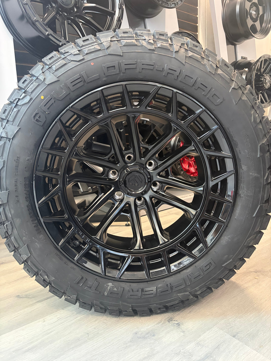 (SET OF FOUR) FUEL FC874 CELSIUS MATTE BLACK W/ GLOSS BLACK LIP 20X10 -18 6x139.7 106.1 | LT 285/55R20 Fuel Gripper AT II
