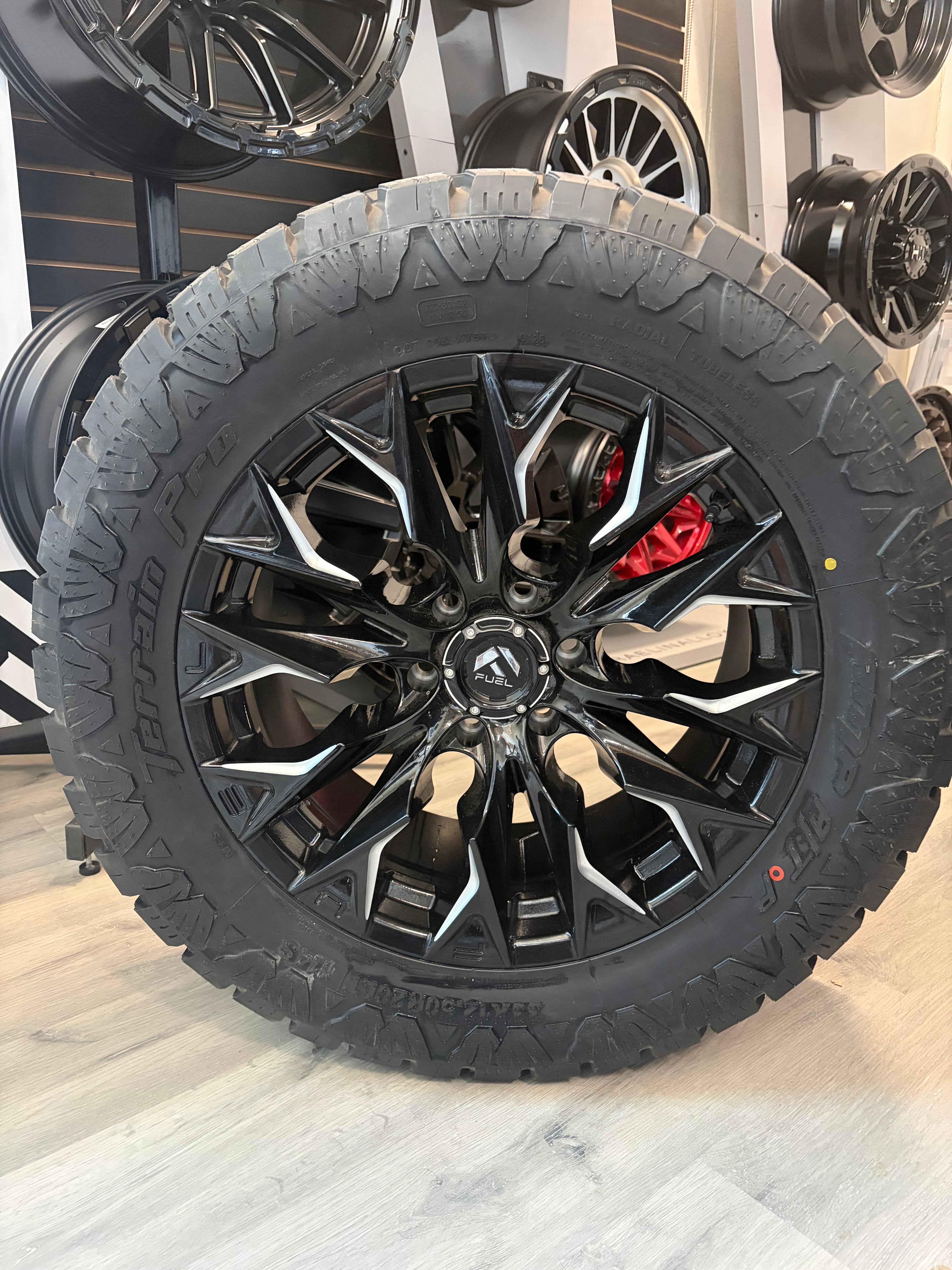 (SET OF FOUR) FUEL FLAME GLOSS BLACK MILLED 20X9 +20 6X135 87.1MM | 33X12.50r20 AMP PRO AT