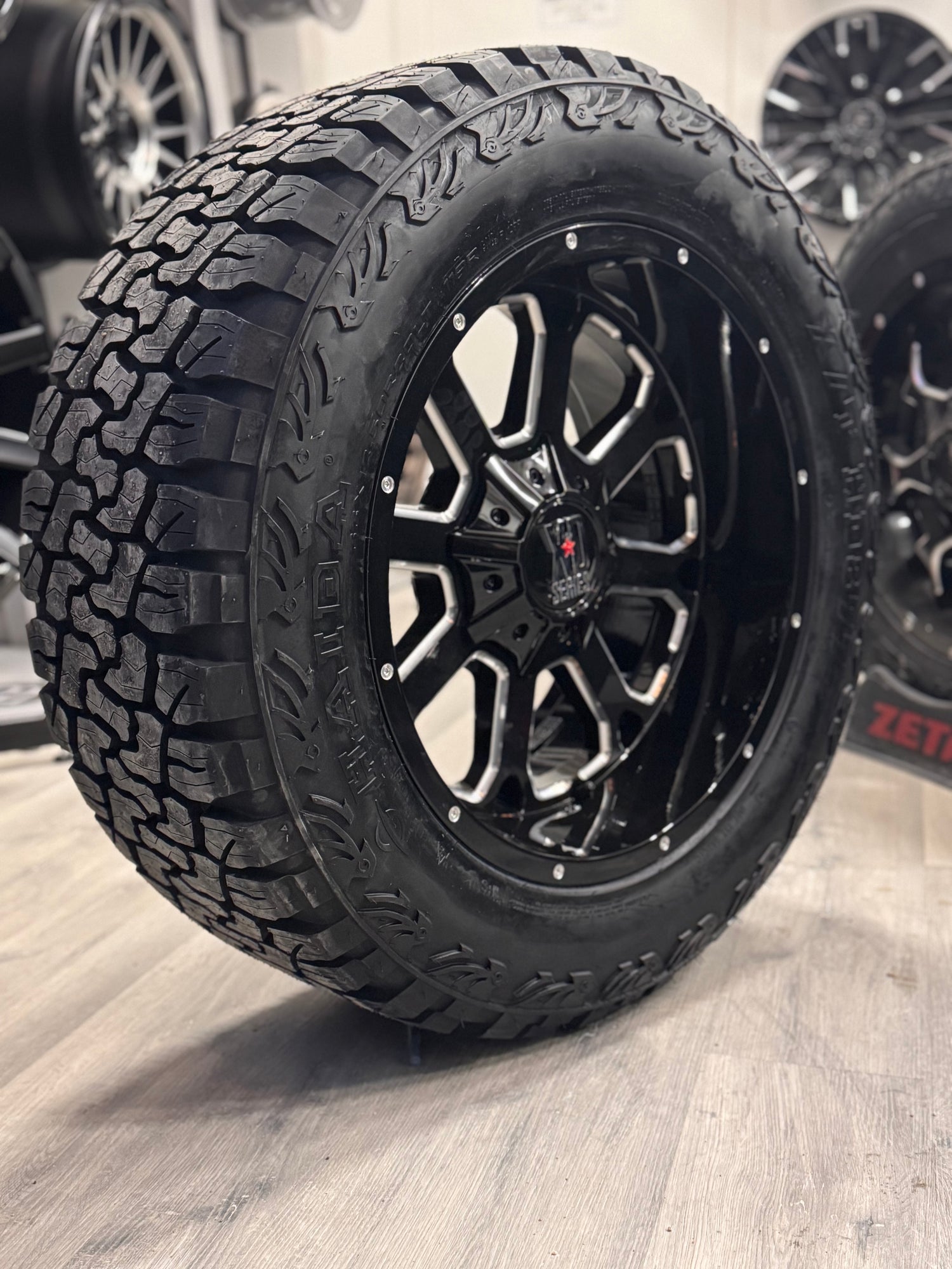 (SET OF FOUR) XD SERIES XD825 BUCK GLOSS BLACK MILLED 20X10 8X165.1 -24 125.1MM | HAIDA HD 877 X/T ALL TERRAIN| LT 33x12.50R20 (12PLY)