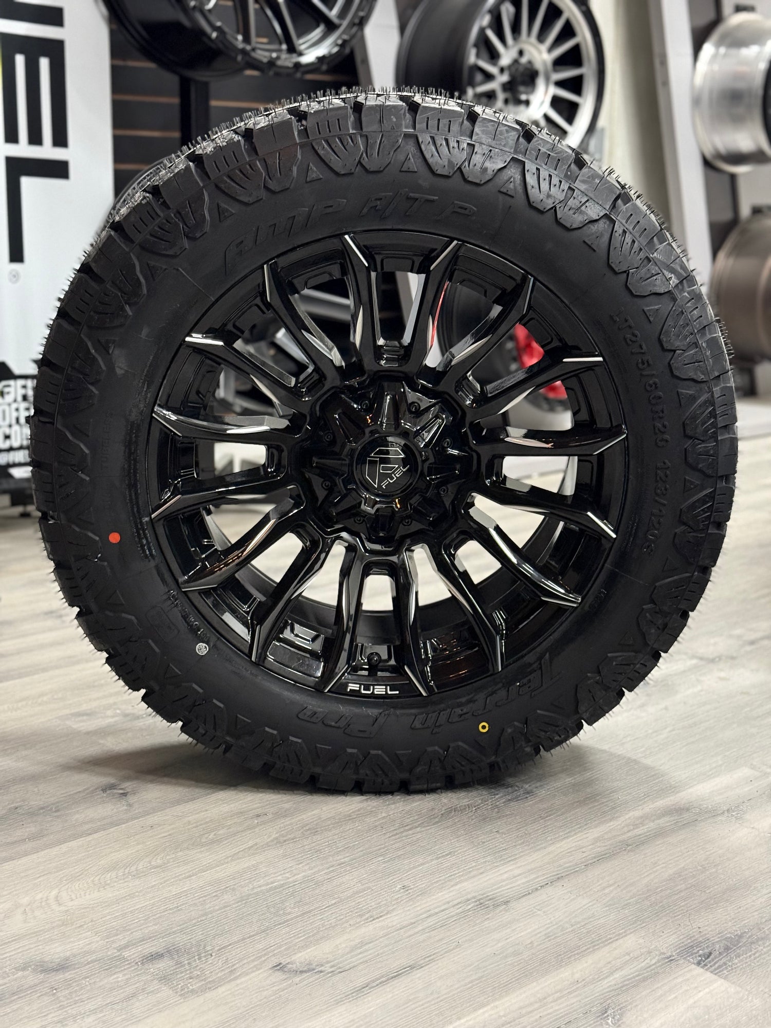 (SET OF FOUR) Fuel Blade Gloss BLK MILLED 20x9 6x135/6x139.7 +1 106.1MM | LT 275/60r20 Amp Terrain Pro 10PR