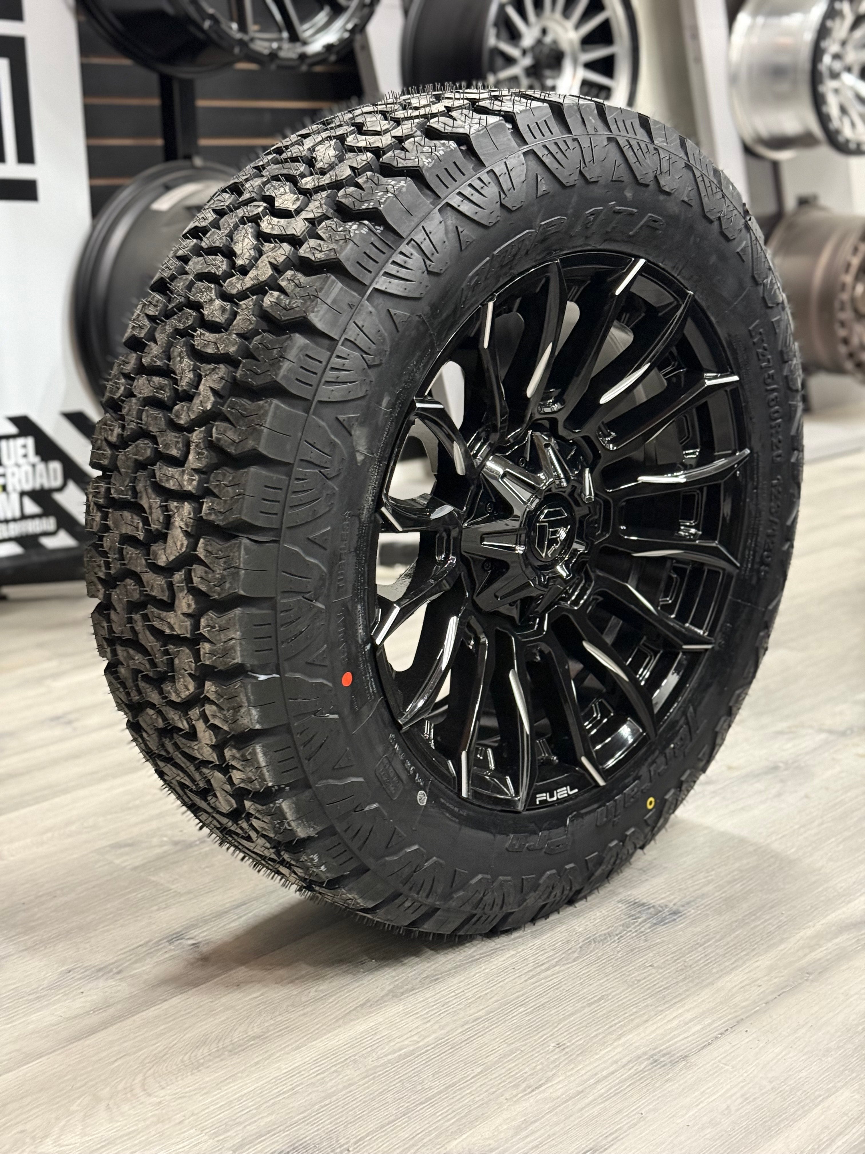(SET OF FOUR) Fuel Blade Gloss BLK MILLED 20x9 6x135/6x139.7 +1 106.1MM | LT 275/60r20 Amp Terrain Pro 10PR