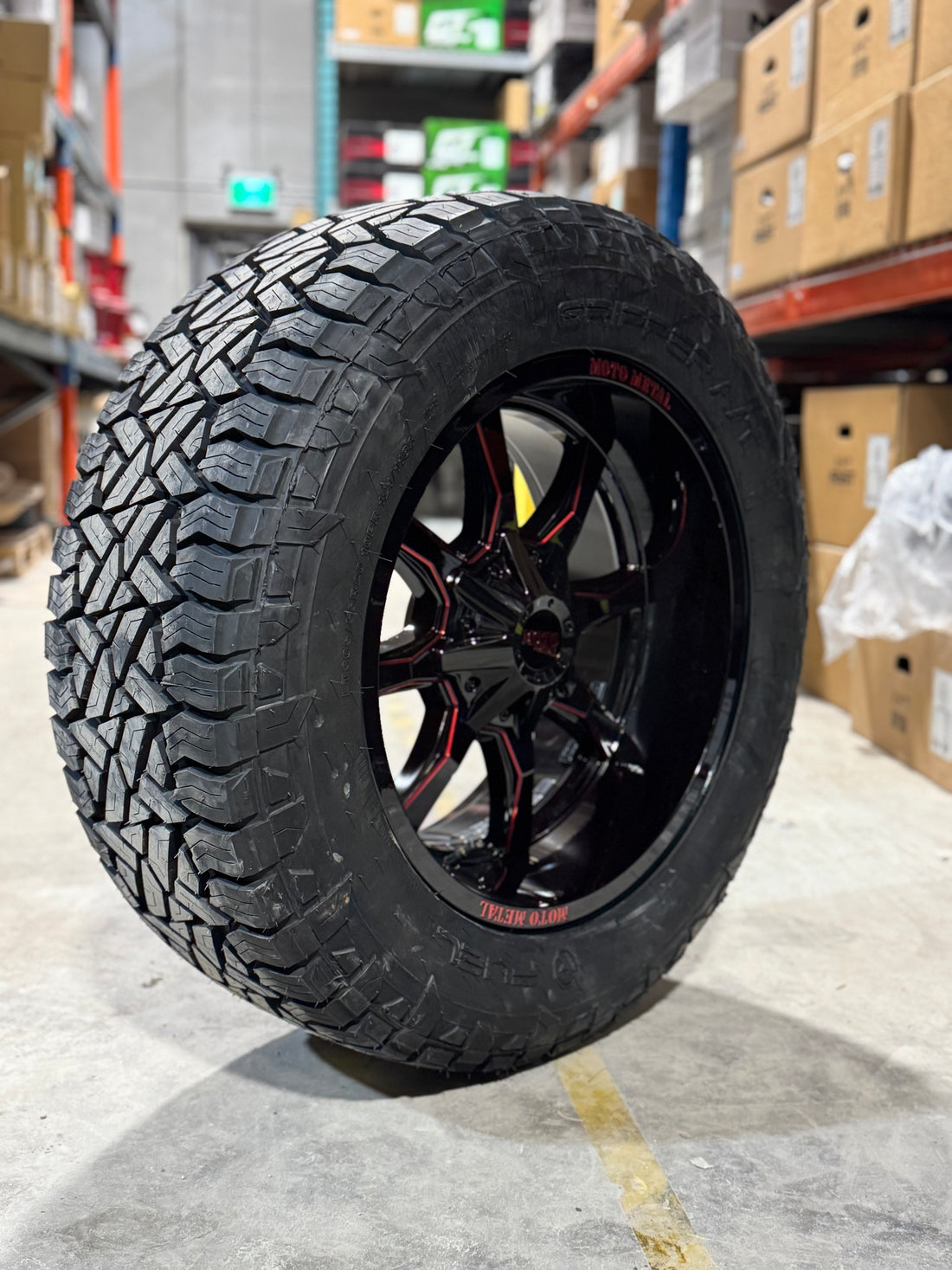 ( SET OF FOUR ) MOTO METAL 970 20X10 5X139.7/5X127 78.10 -18 GLOSS BLACK MILLED WITH RED TINT | FUEL GRIPPER A/T 3PMS 305/55R20