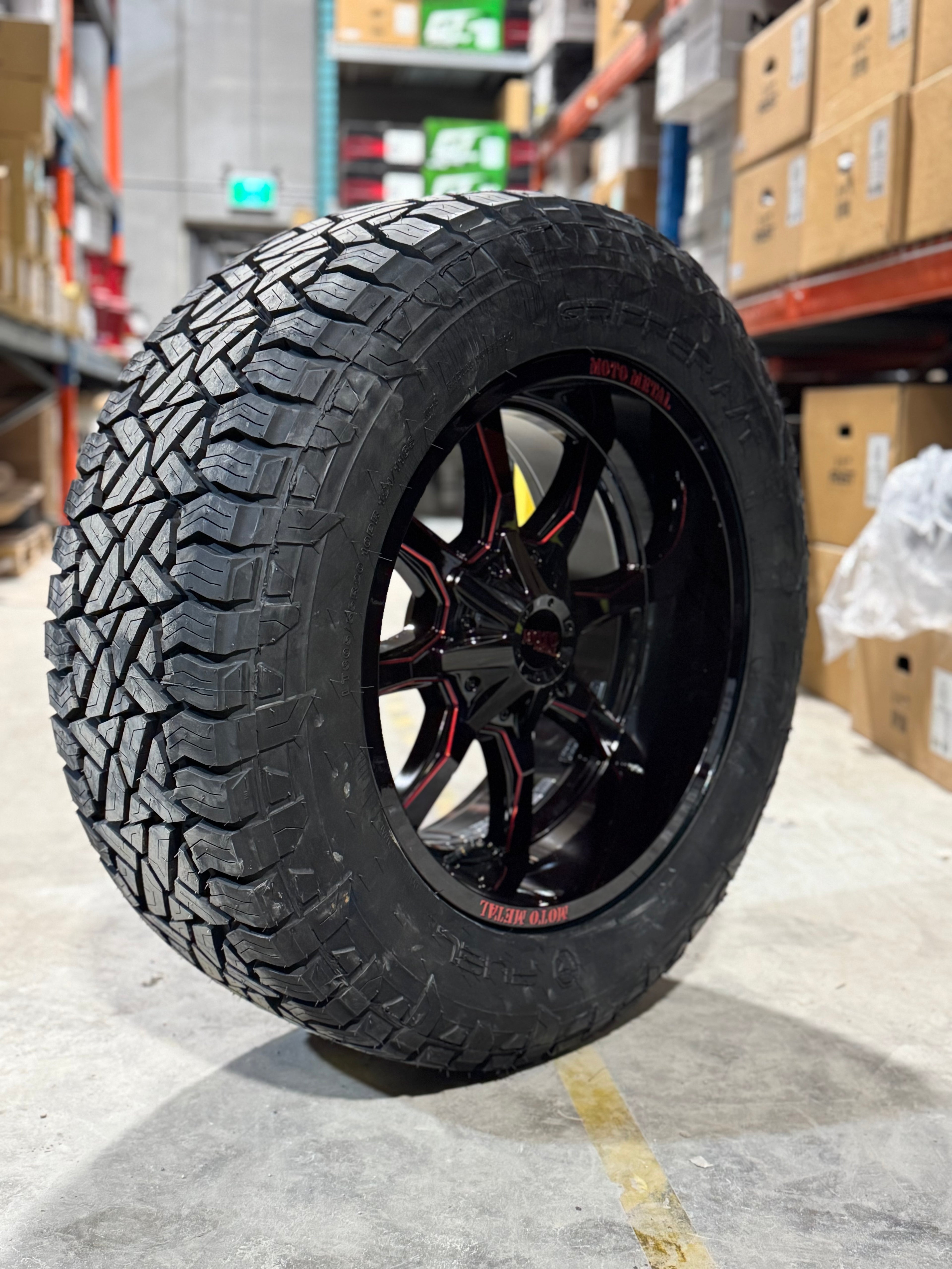 ( SET OF FOUR ) MOTO METAL 970 20X10 5X139.7/5X127 78.10 -18 GLOSS BLACK MILLED WITH RED TINT | FUEL GRIPPER A/T 3PMS 305/55R20