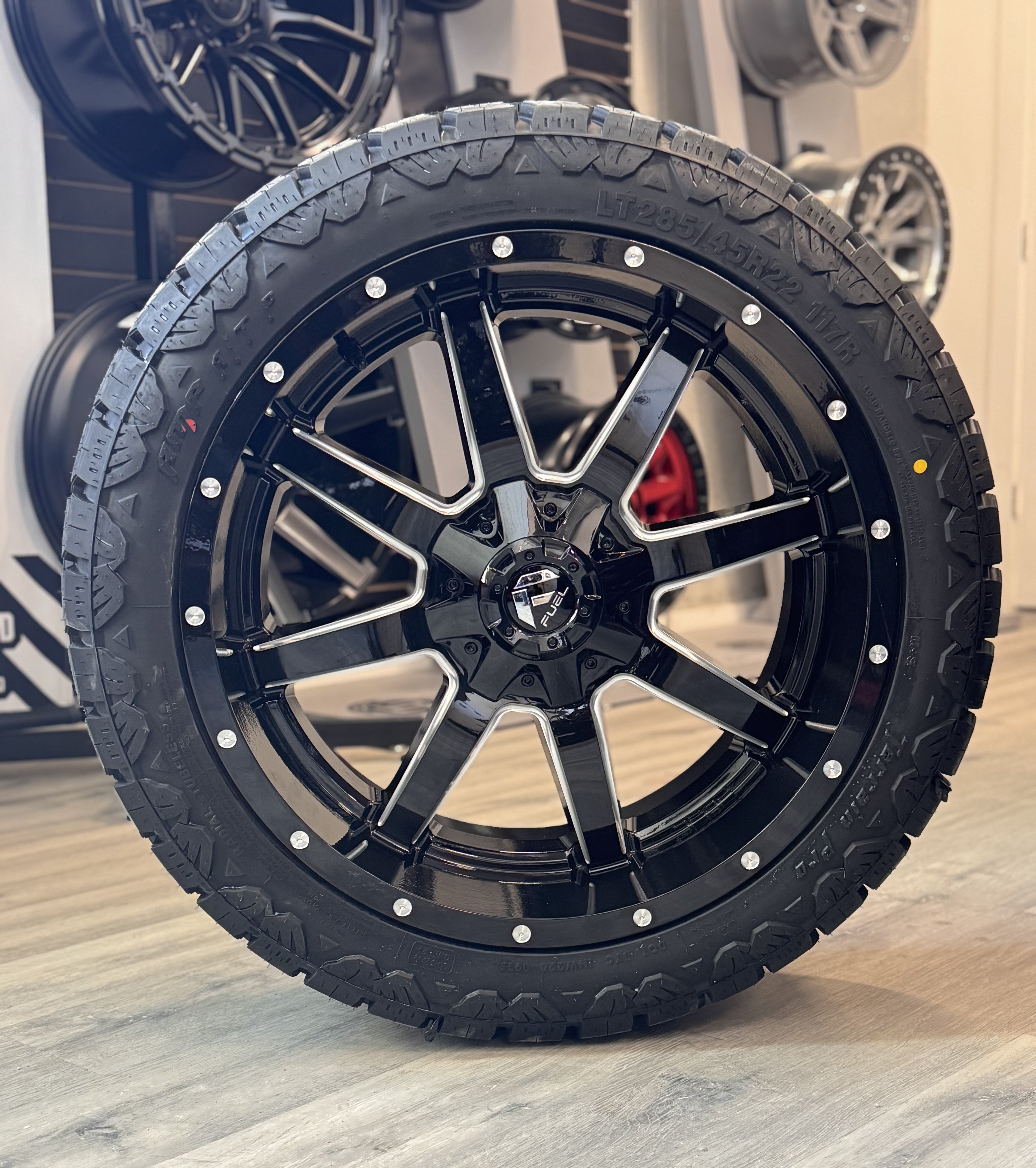 (SET OF FOUR) FUEL MAVERICK GLOSS BLACK MILLED 22X10 6X135/6X139.7 +10 106.1MM | AMP TERRAIN PRO A/T | LT285/45R22